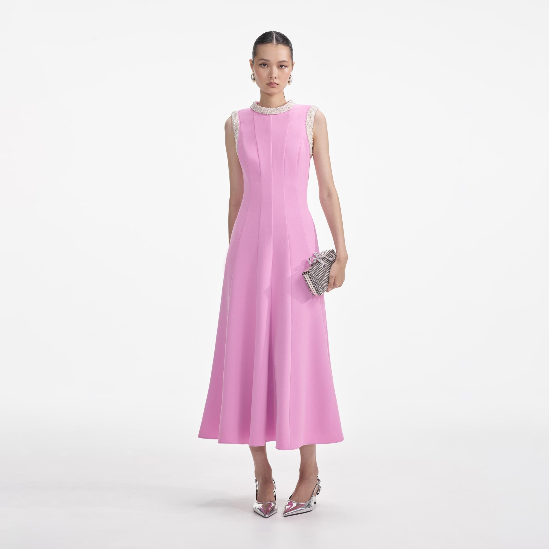 Front view of a woman wearing the Pink Crepe Pearl Trim Midi Dress