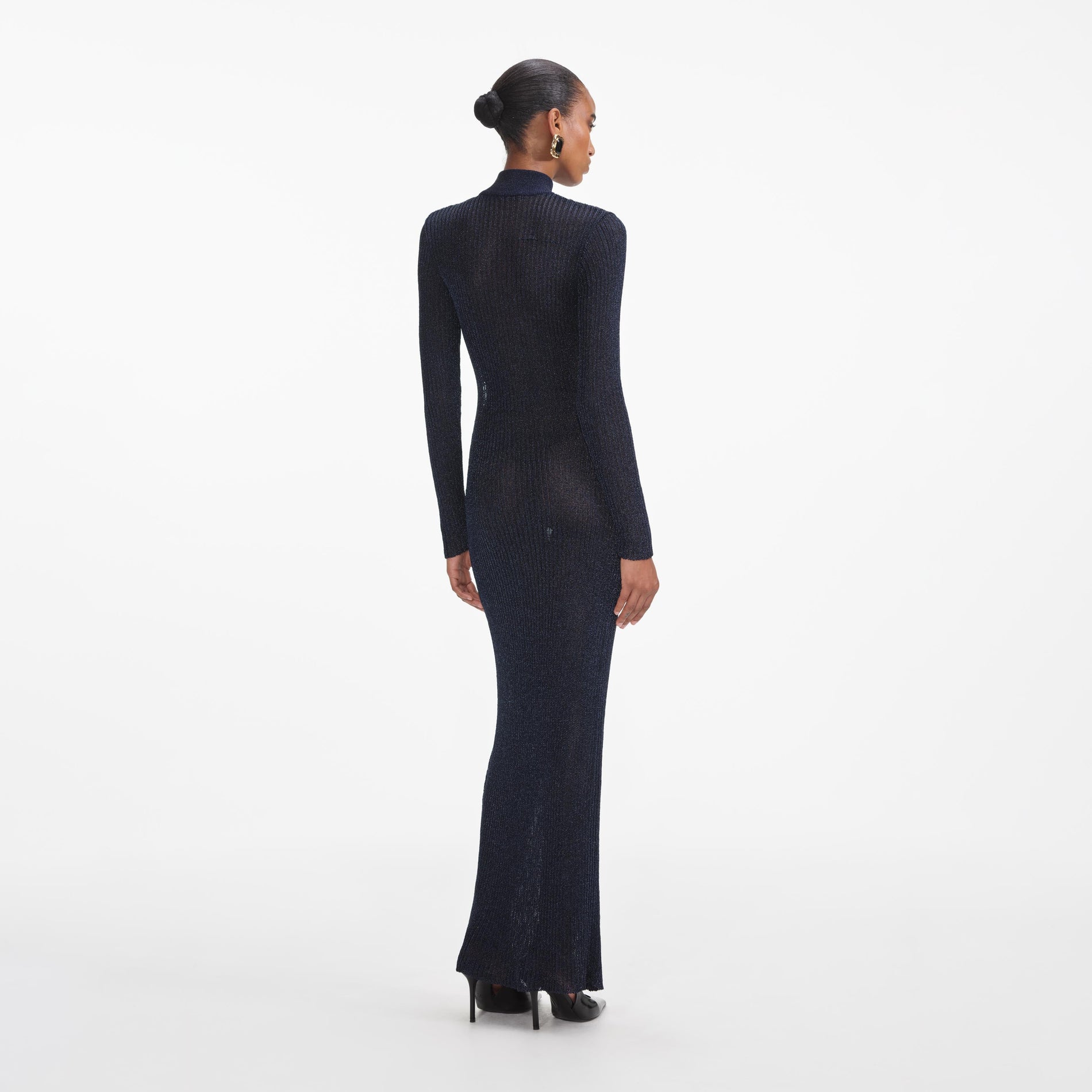 Back view of a woman wearing the Navy Lurex Knit Maxi Dress