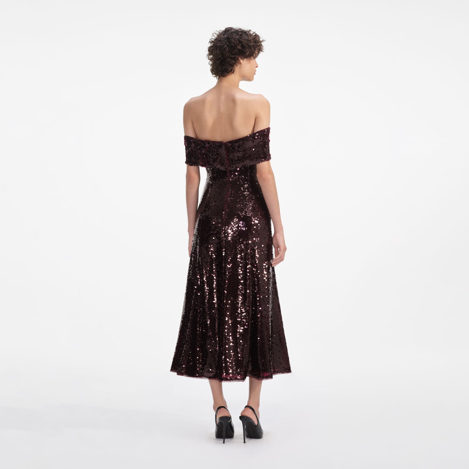 Back view of a woman wearing the Brown Sequin Off Shoulder Midi Dress