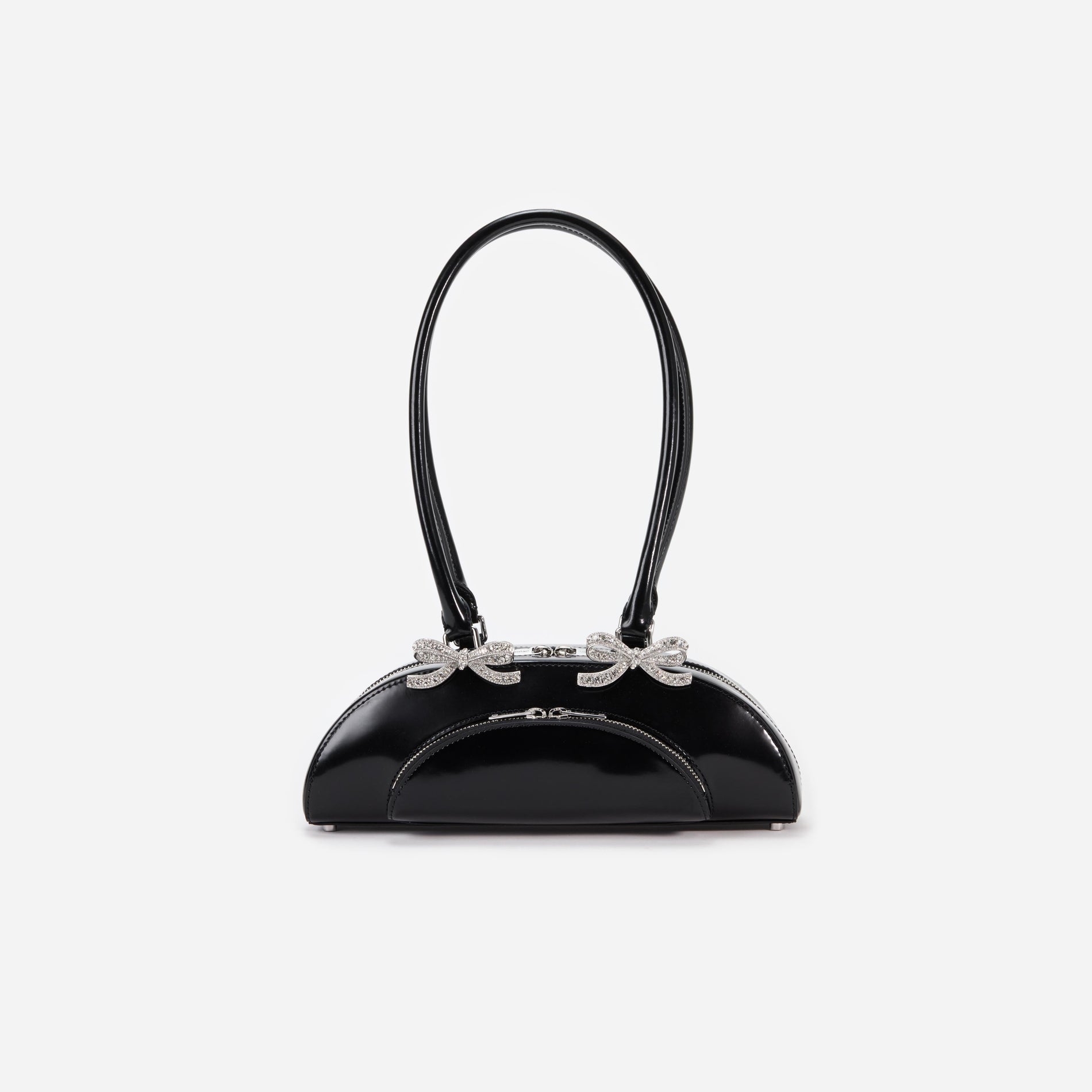 Front view of a woman wearing the Black Leather Curved Shoulder Bag