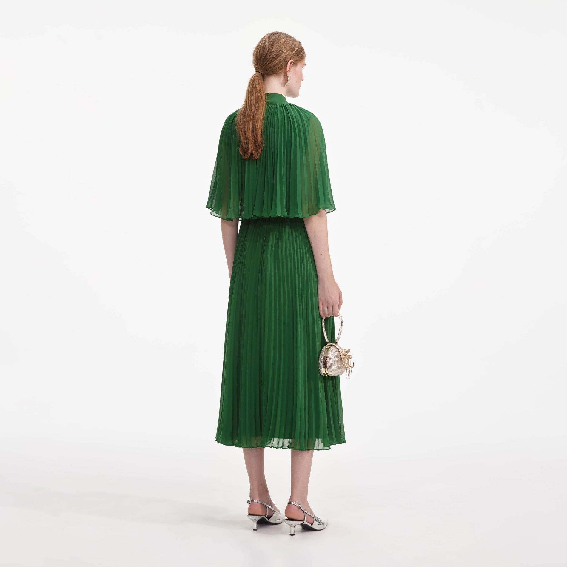 Back view of a woman wearing the Green Chiffon Cape Midi Dress