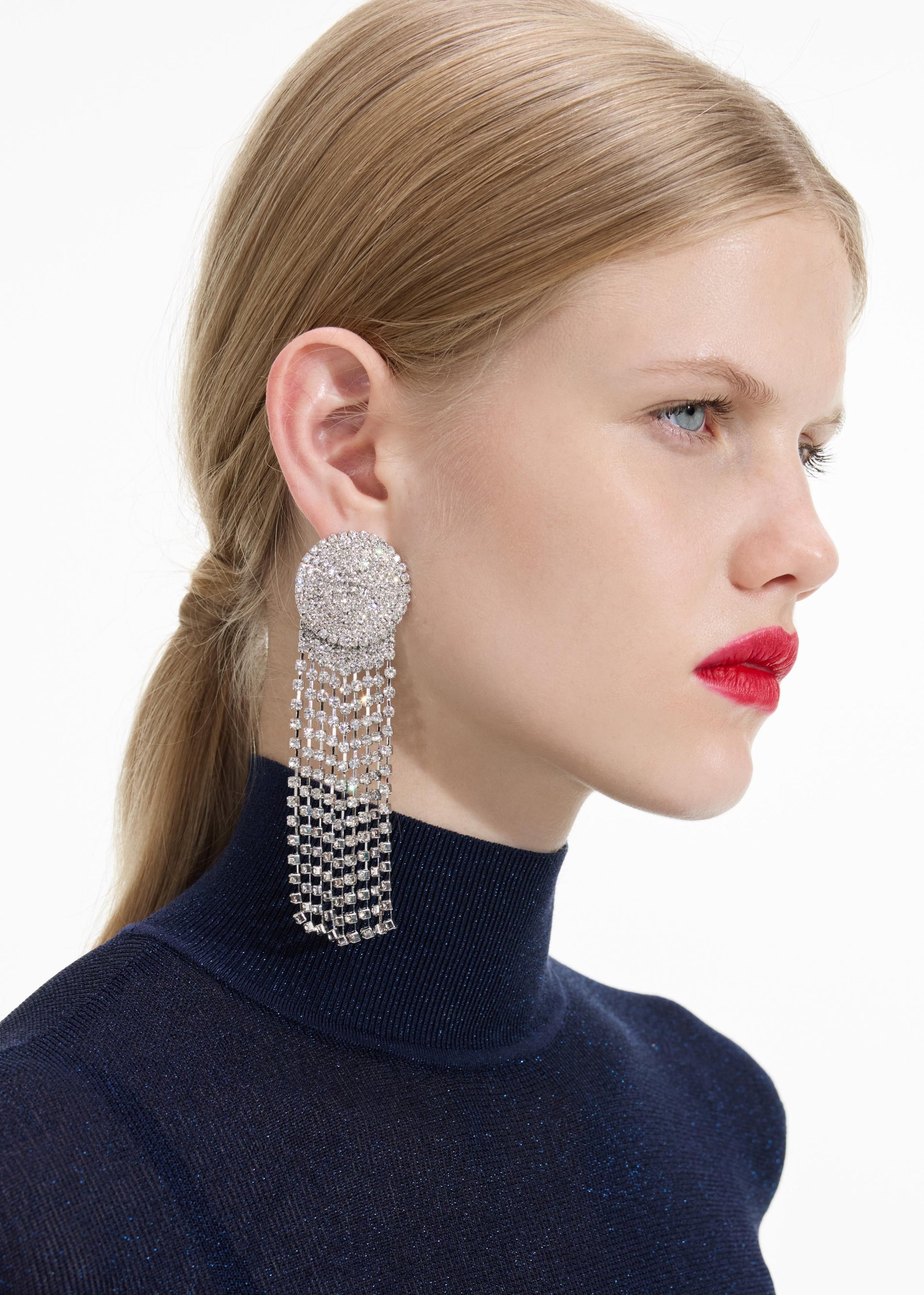 Back view of a woman wearing the Round Crystal Droplet Earrings