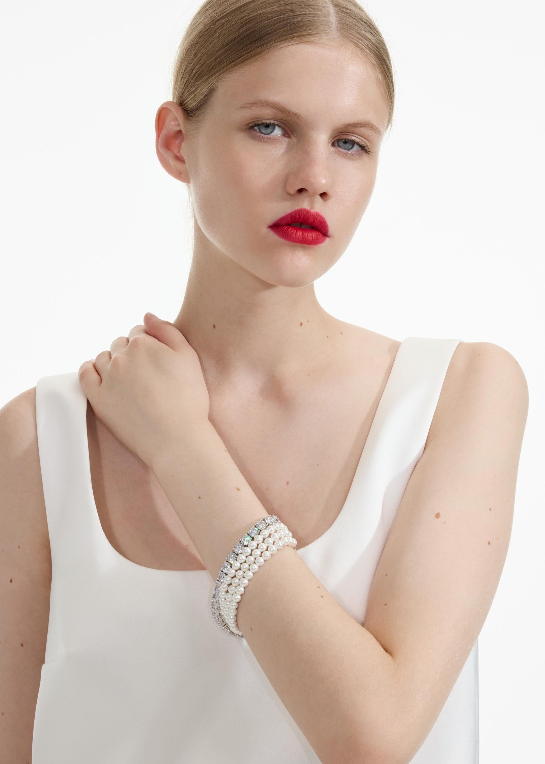 Front view of a woman wearing the Pearl Diamante Bracelet