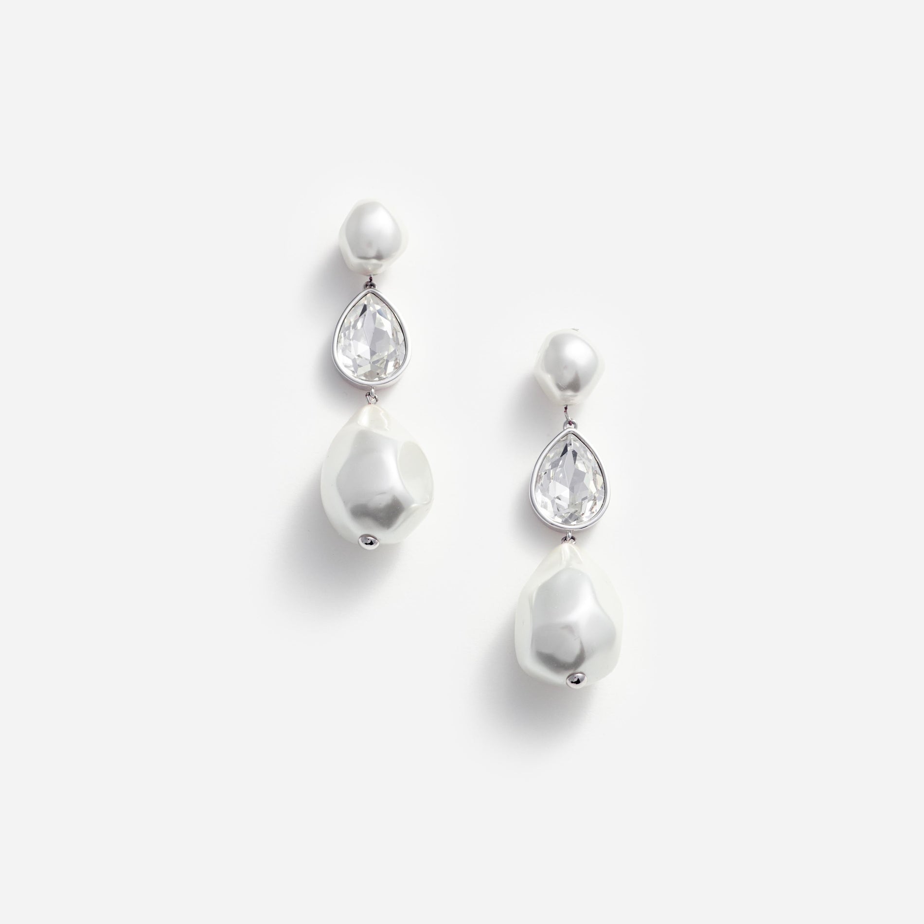 Front view of a woman wearing the Pearl Crystal Droplet Earrings