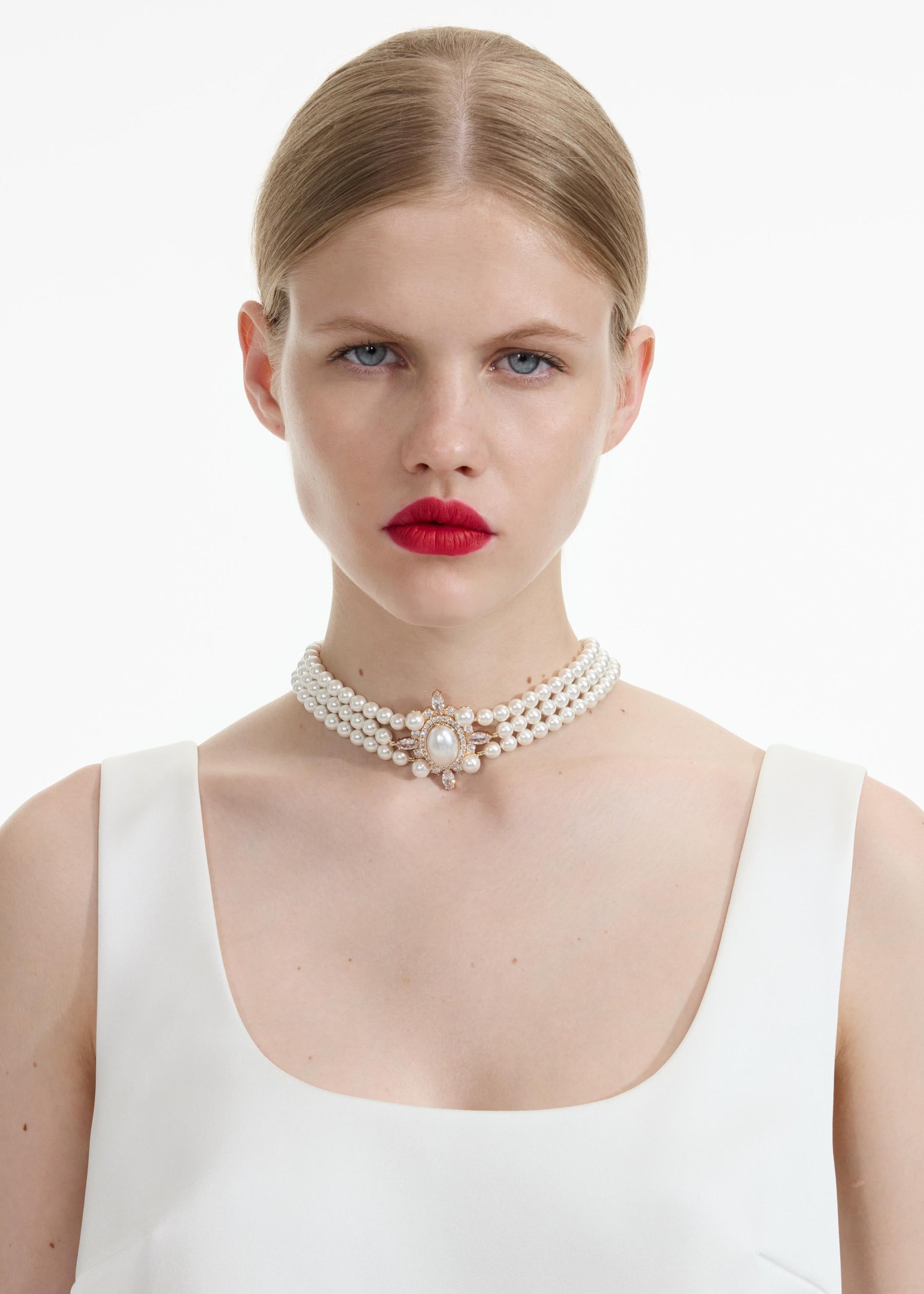 Front view of a woman wearing the Gold Pearl Choker