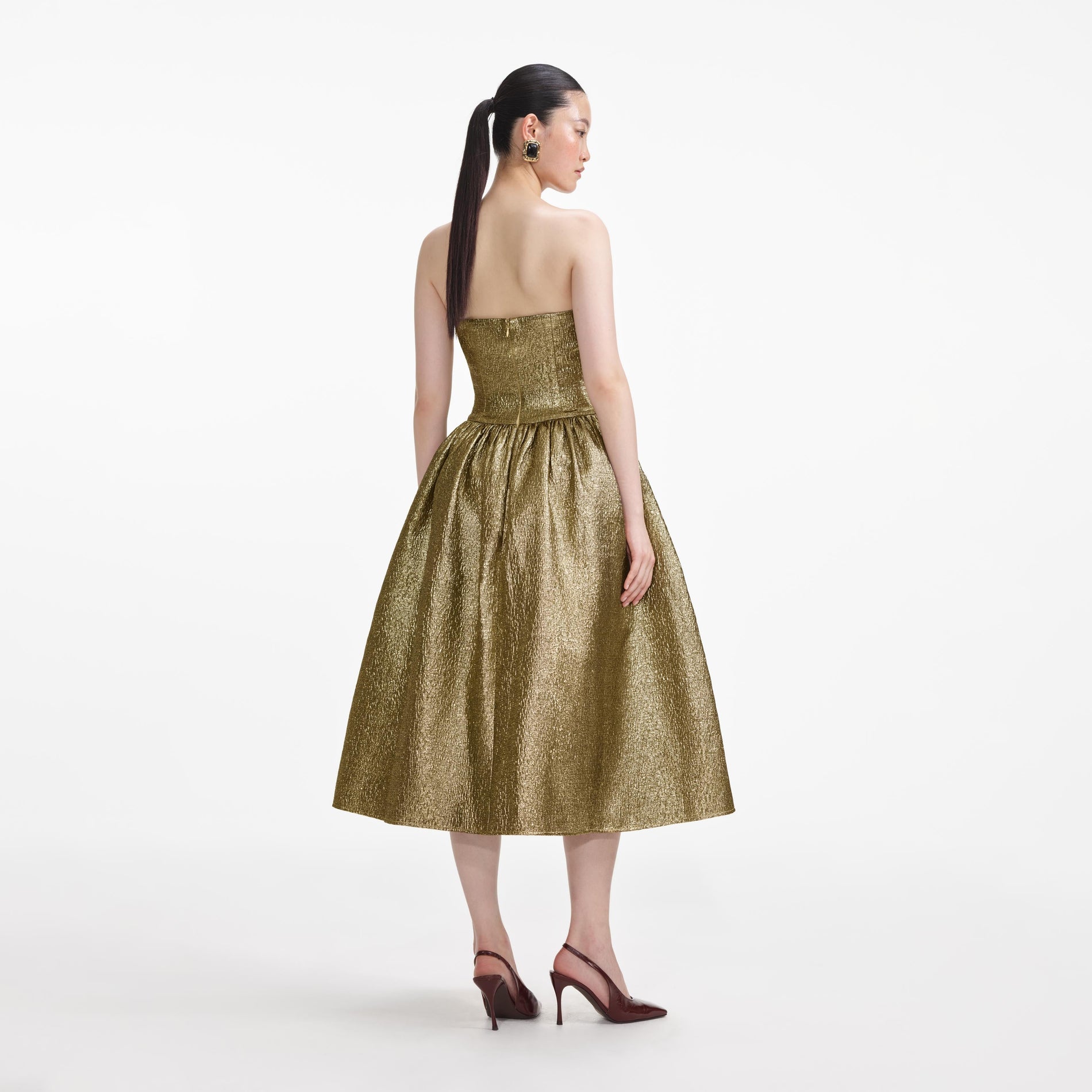 Back view of a woman wearing the Gold Metallic Jacquard Midi Dress