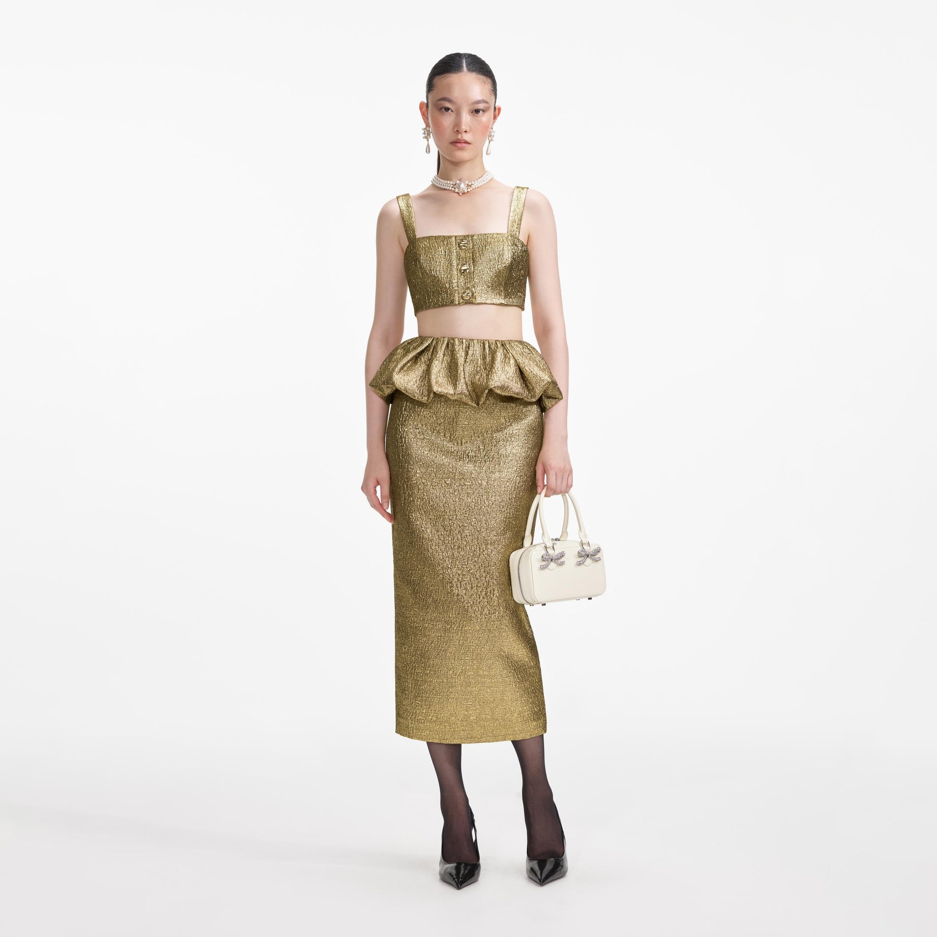 Front view of a woman wearing the Gold Metallic Jacquard Midi Skirt