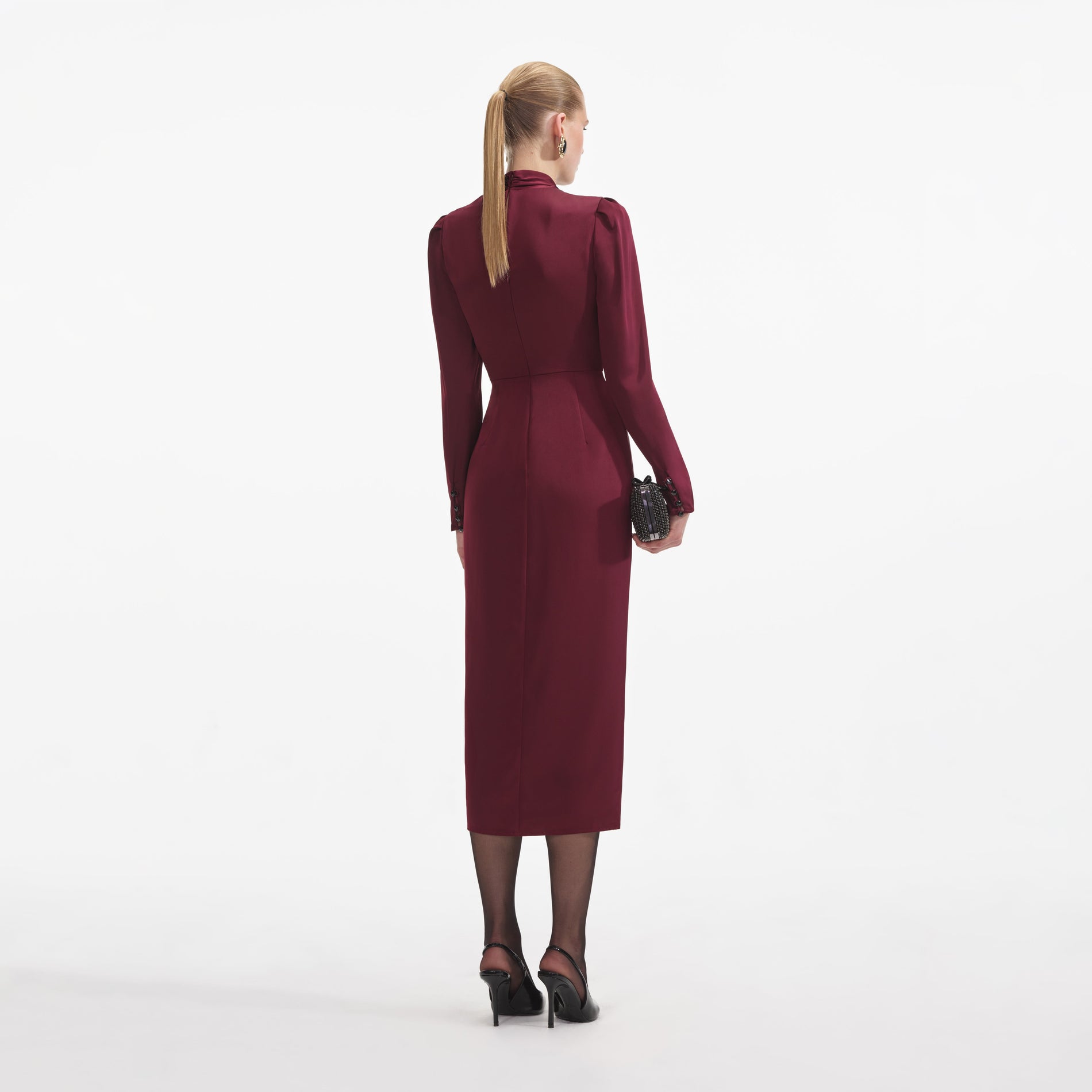 Back view of a woman wearing the Burgundy Satin Midi Dress