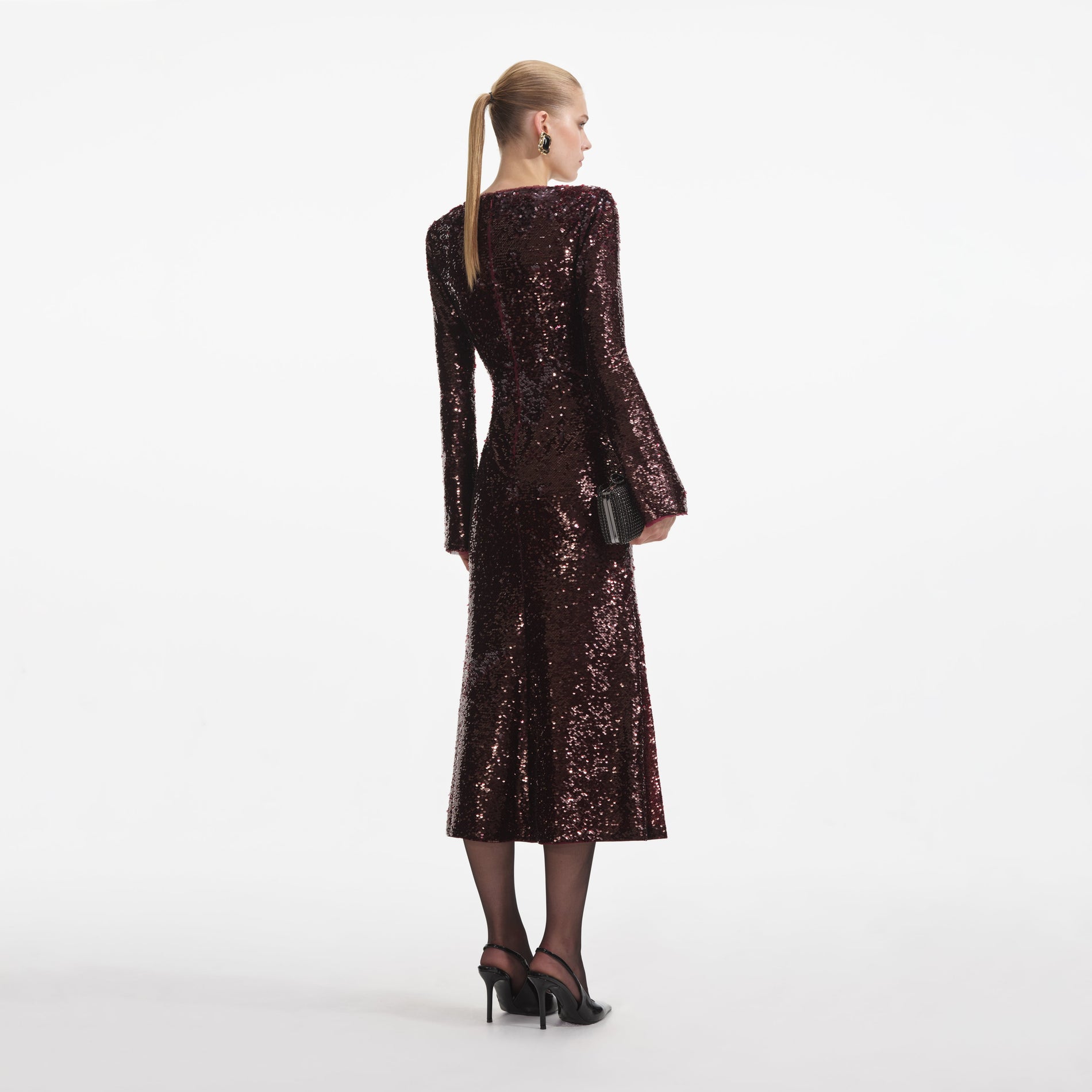 Back view of a woman wearing the Burgundy Sequin Midi Dress