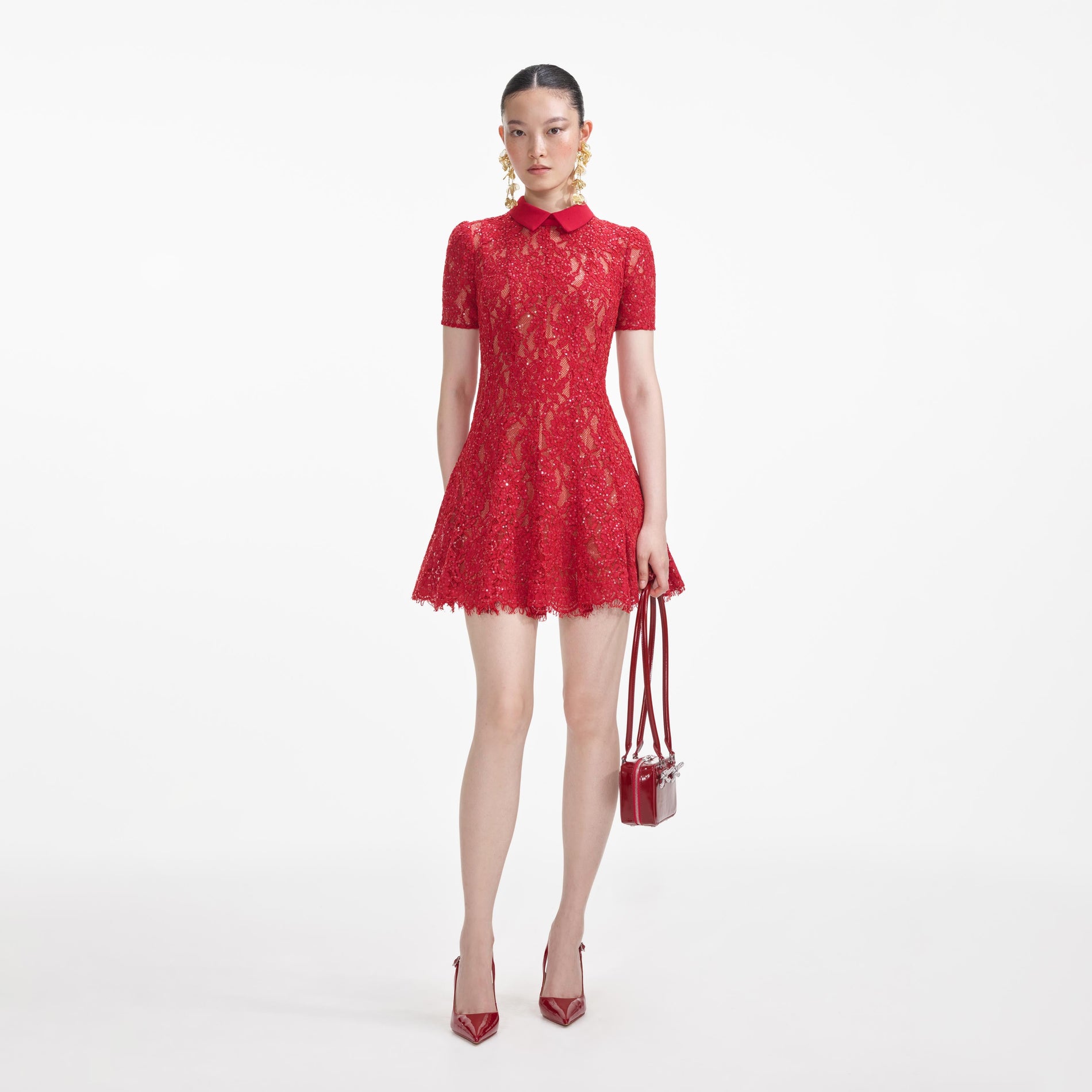 Front view of a woman wearing the Red Sequin Lace Mini Dress