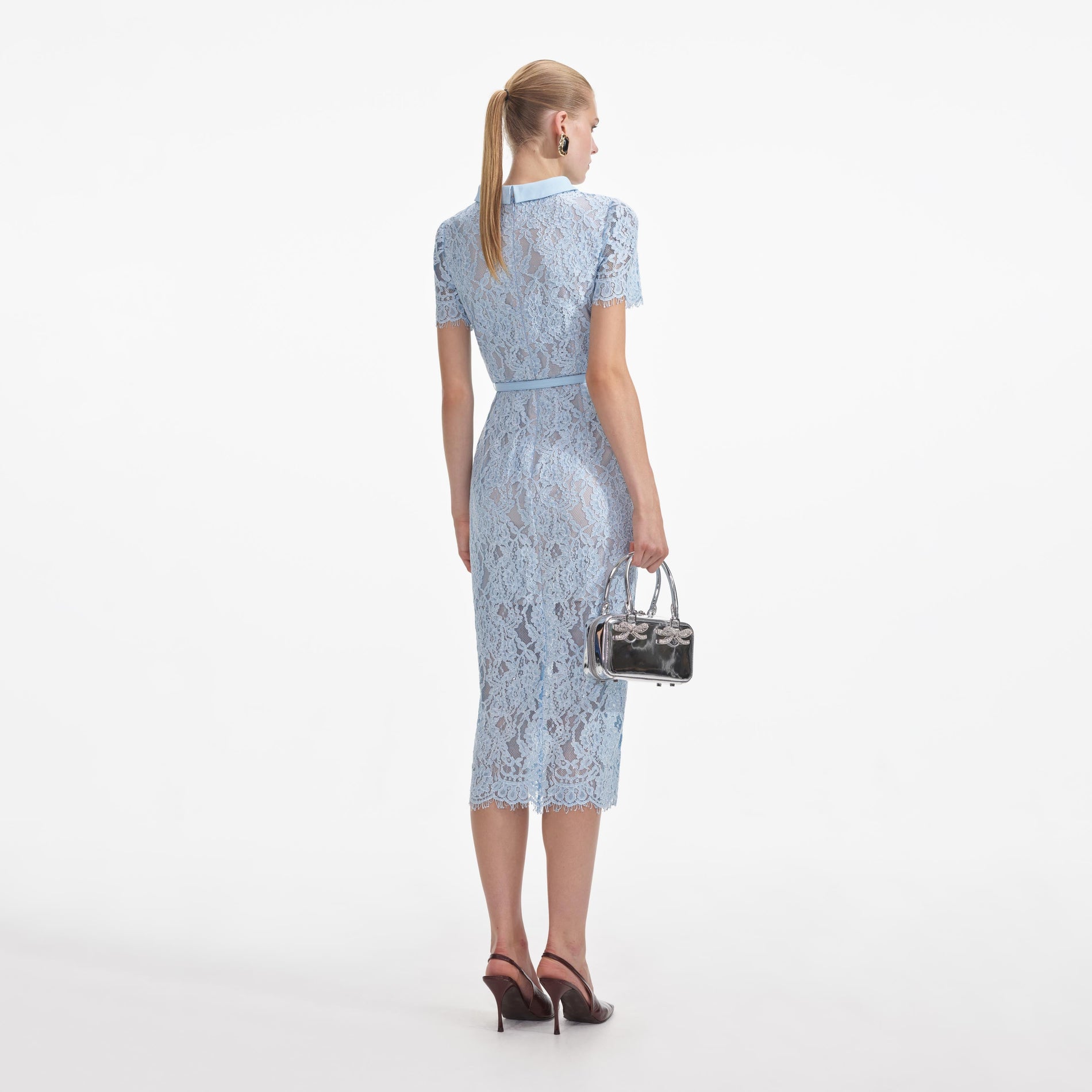 Back view of a woman wearing the Blue Lace Button Midi Dress