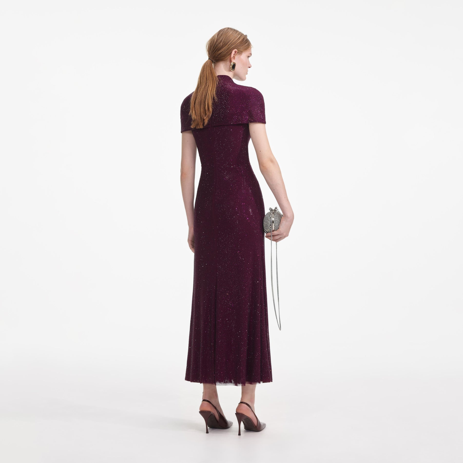 Back view of a woman wearing the Burgundy Rhinestone Mesh Cut Out Midi Dress