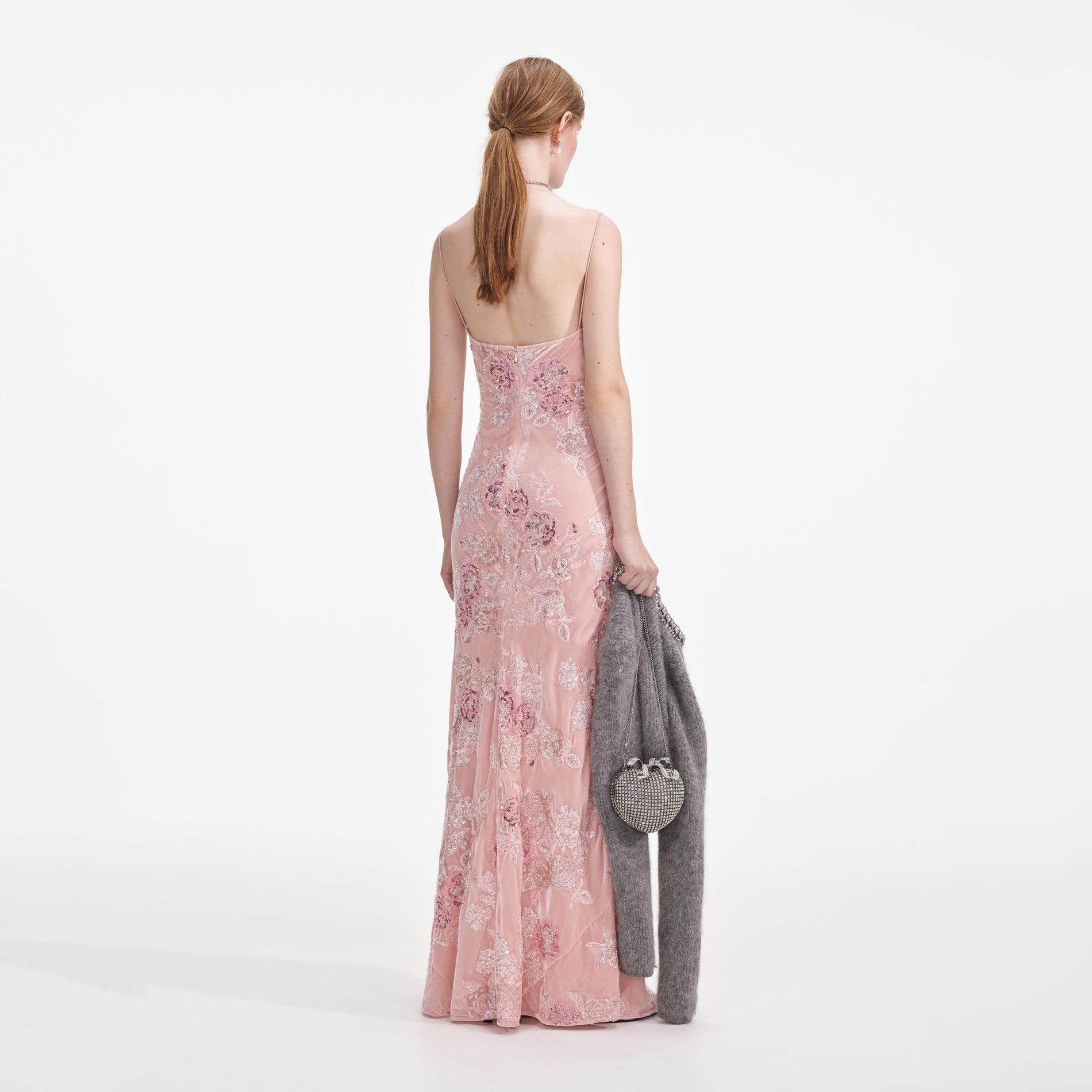 Back view of a woman wearing the Pink Embellished Velvet Maxi Dress