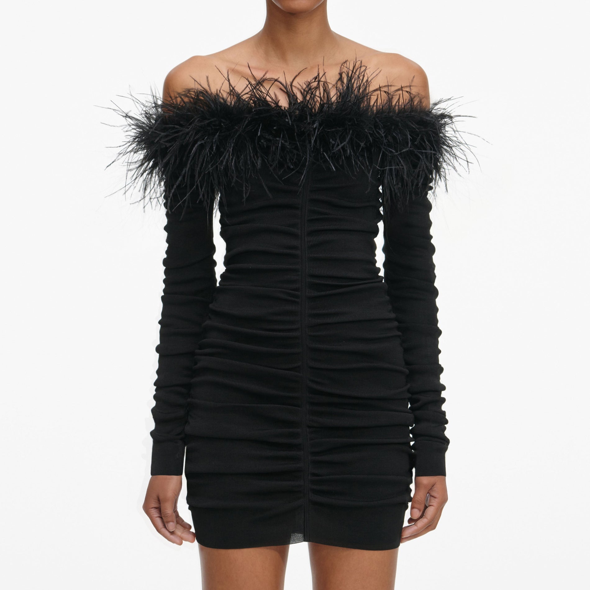 A close up of a woman wearing the Black Feather Viscose Knit Mini Dress