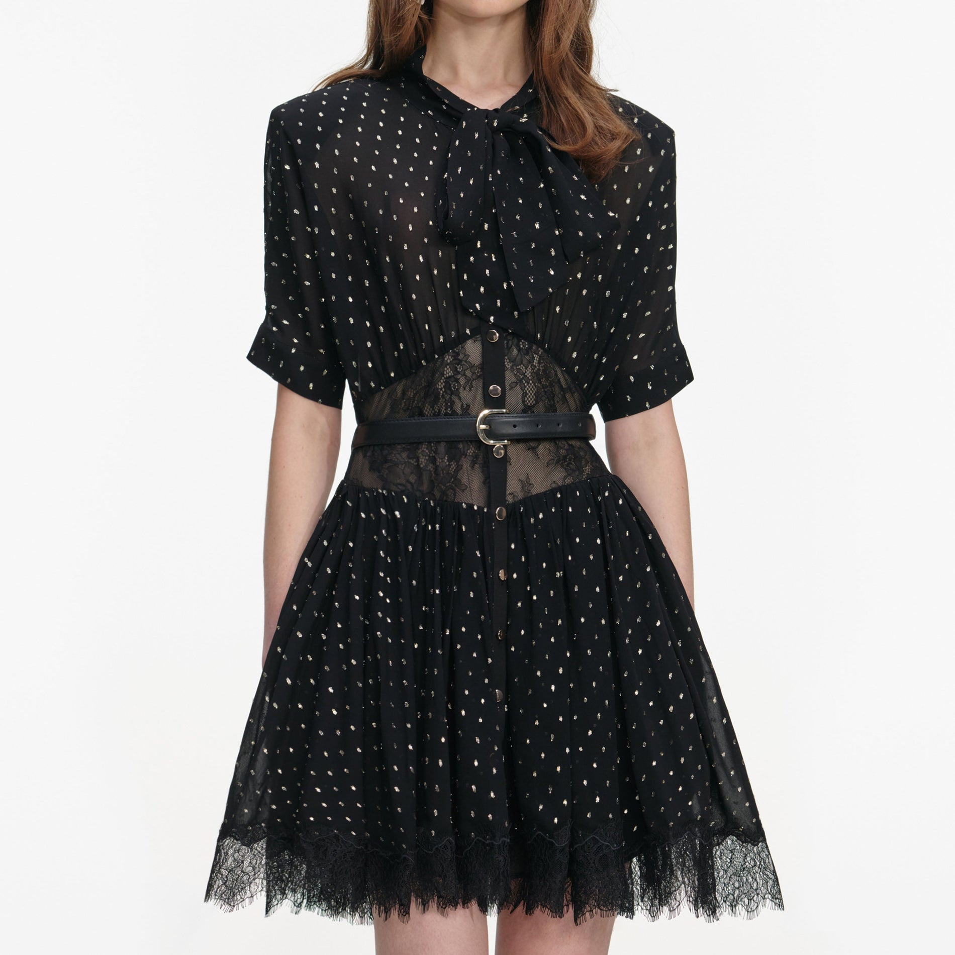 A close up of a woman wearing the Black And Gold Chiffon Mini Dress