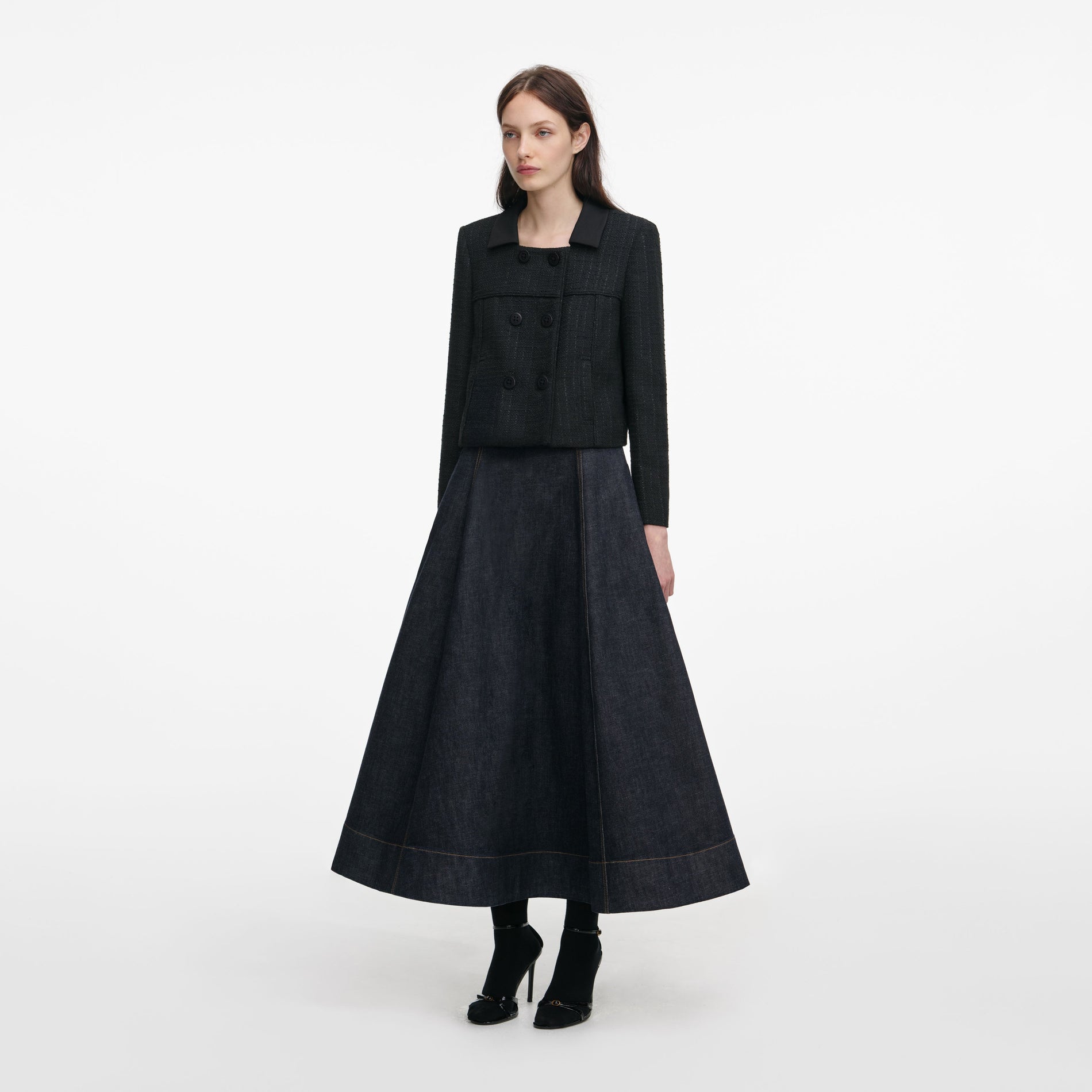 Side view of a woman wearing the Black Boucle Cropped Jacket