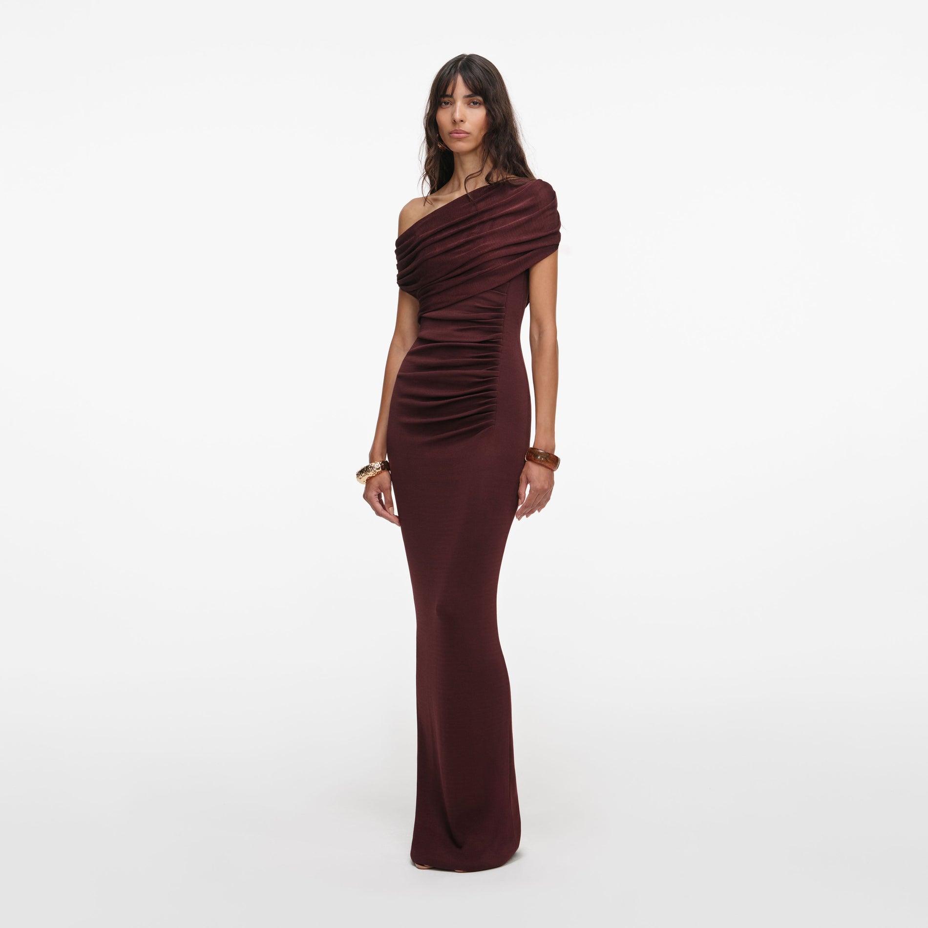 Side view of a woman wearing the Brown Draped Knit Midi Dress
