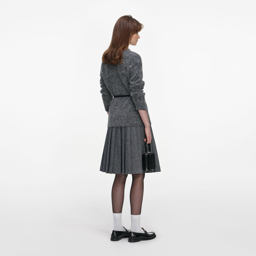 Back view of a woman wearing the Charcoal Crystal Trim Cardigan
