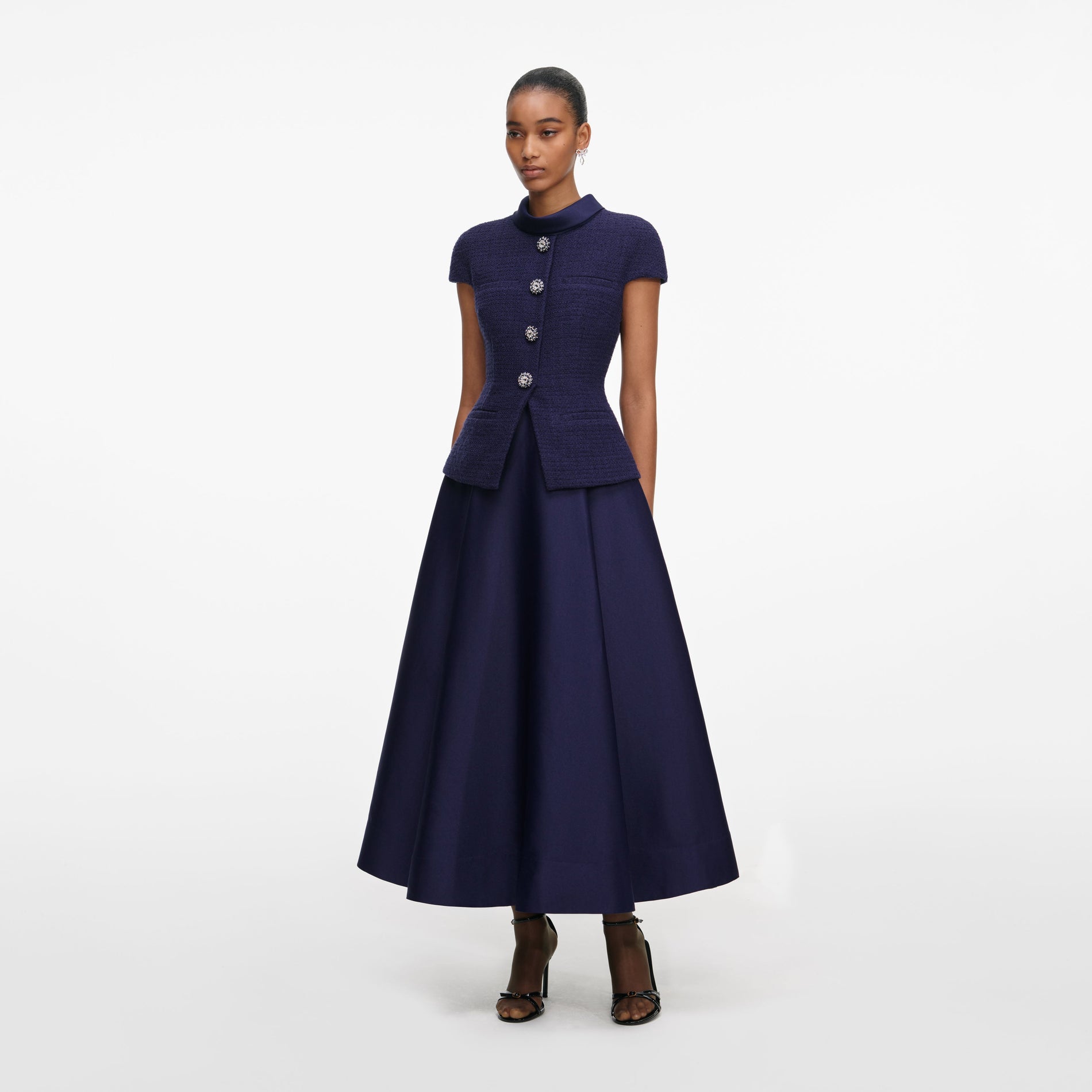 Side view of a woman wearing the Navy Boucle Taffeta Midi Dress
