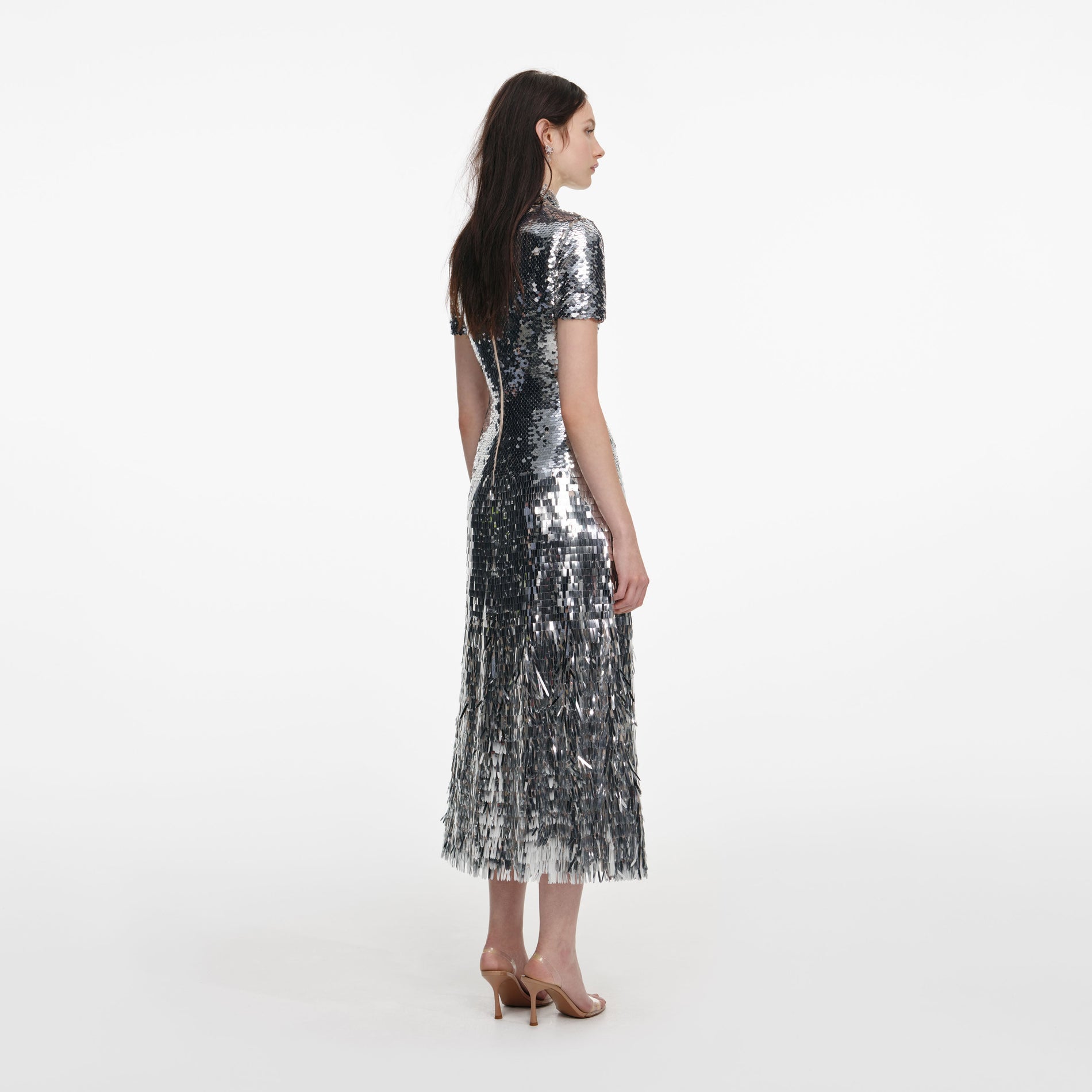 Back view of a woman wearing the Silver Gradient Sequin Midi Dress