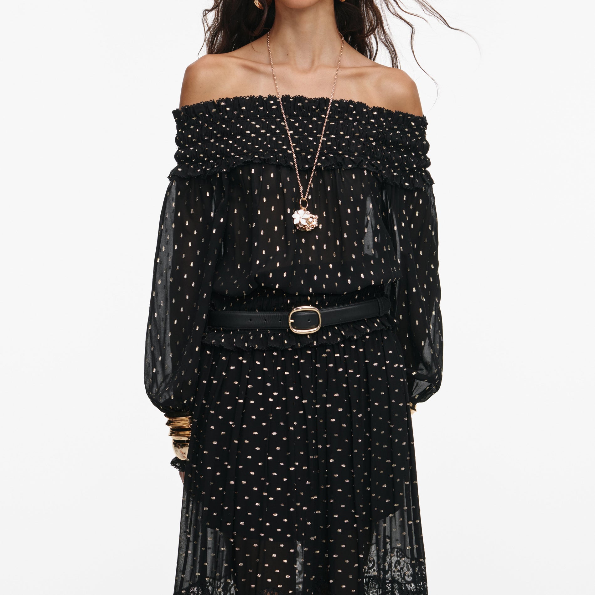 A close up of a woman wearing the Black And Gold Chiffon Lace Maxi Skirt