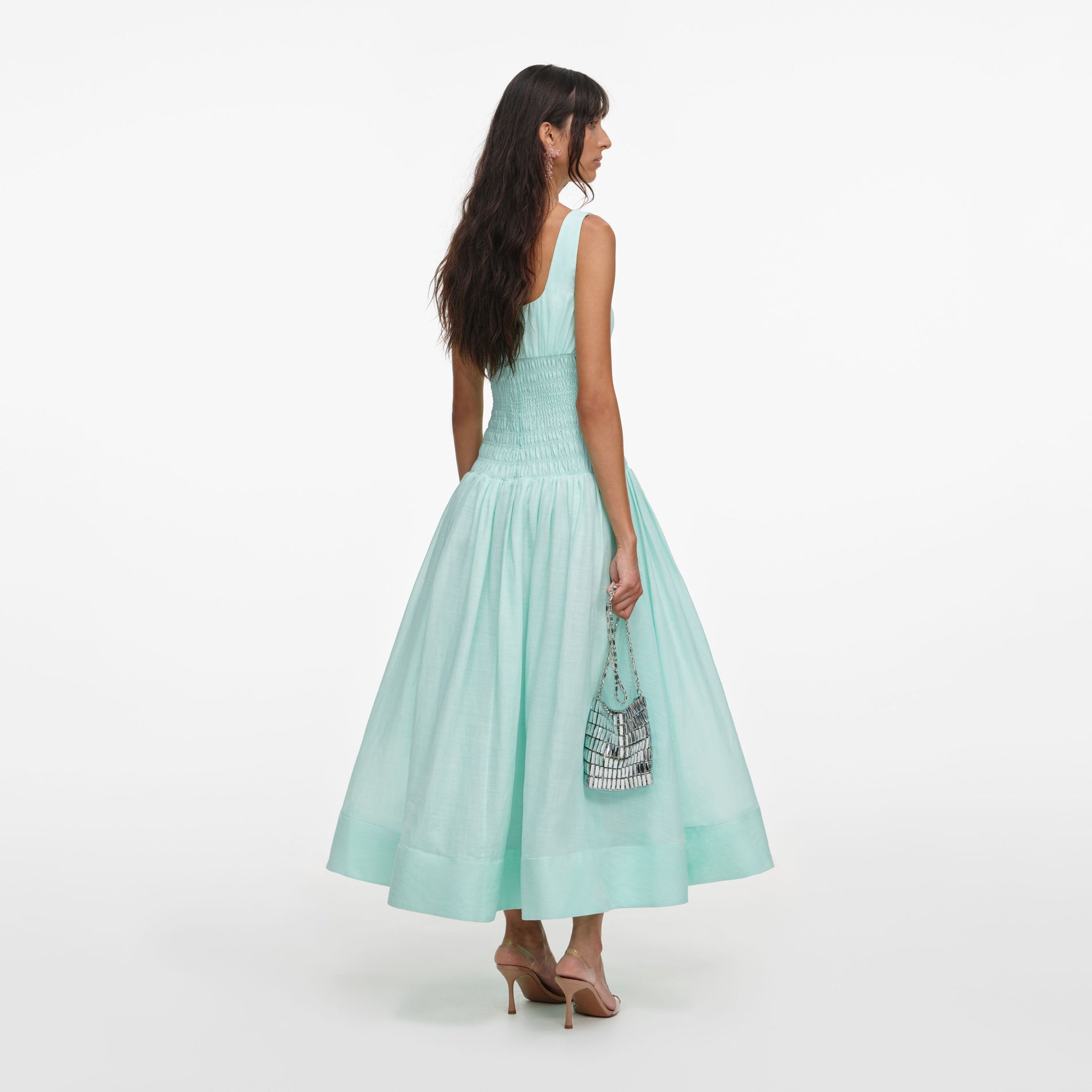 Back view of a woman wearing the Mint Ramie Midi Dress