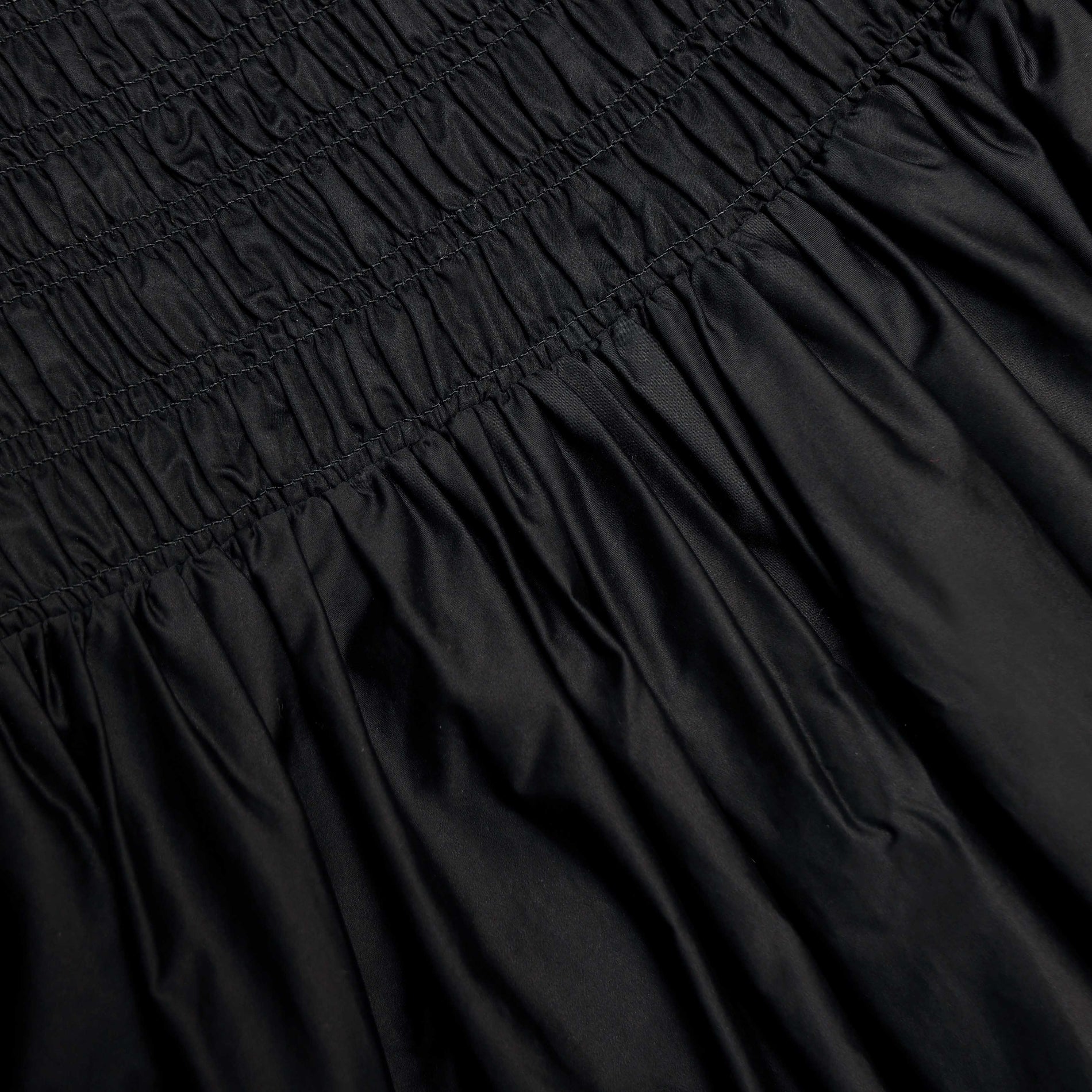 A close up of the fabric for the Black Cotton Midi Skirt