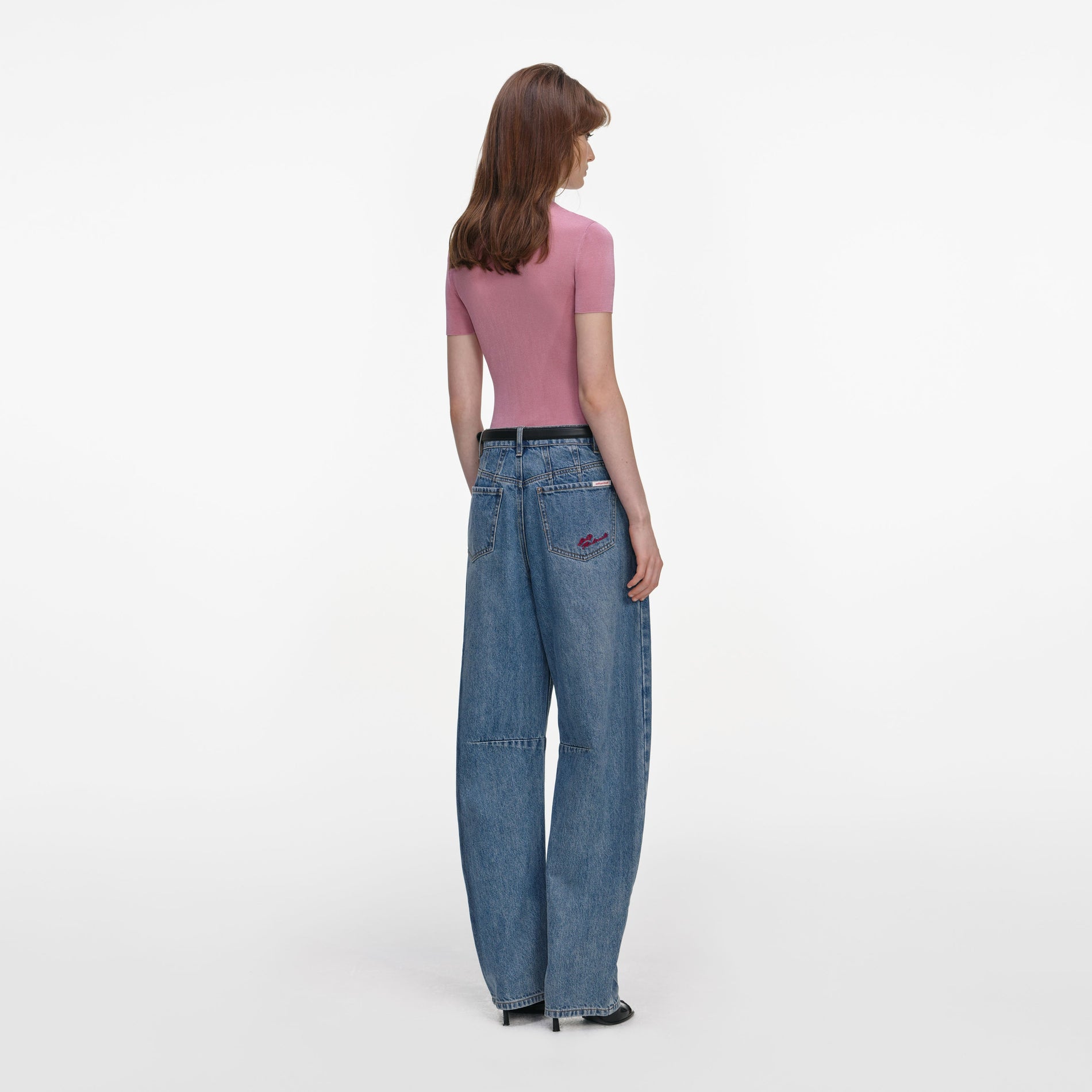 Back view of a woman wearing the Pink Short Sleeve Viscose Knit Top