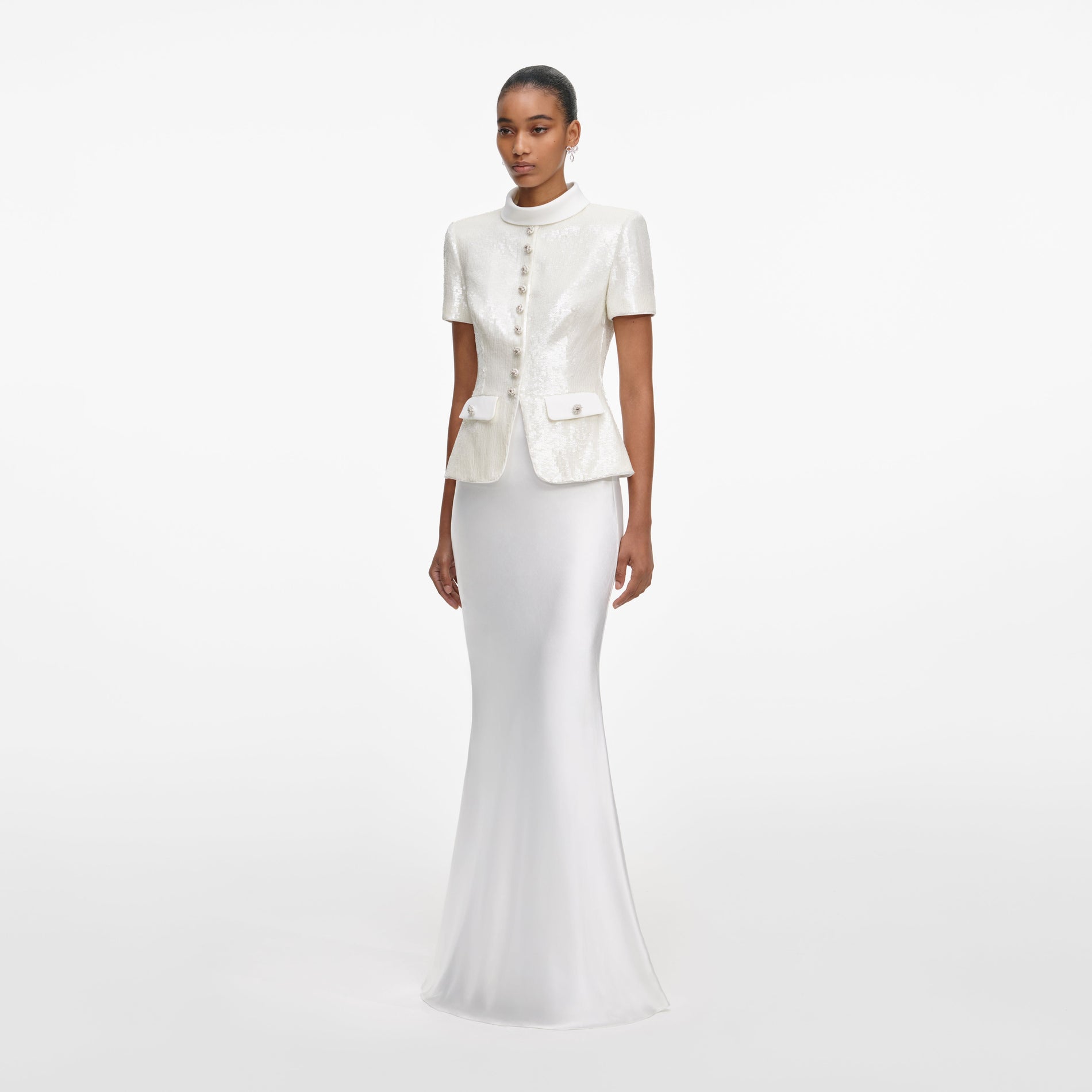 Side view of a woman wearing the White Sequin Tailored Maxi Dress