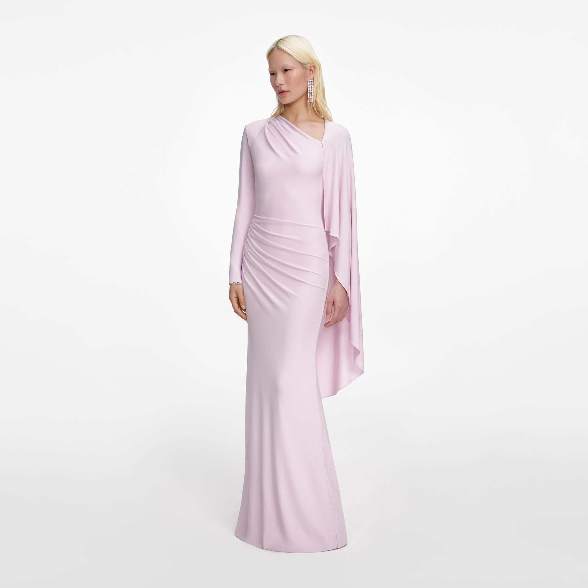 Side view of a woman wearing the Pink Jersey Drape Maxi Dress