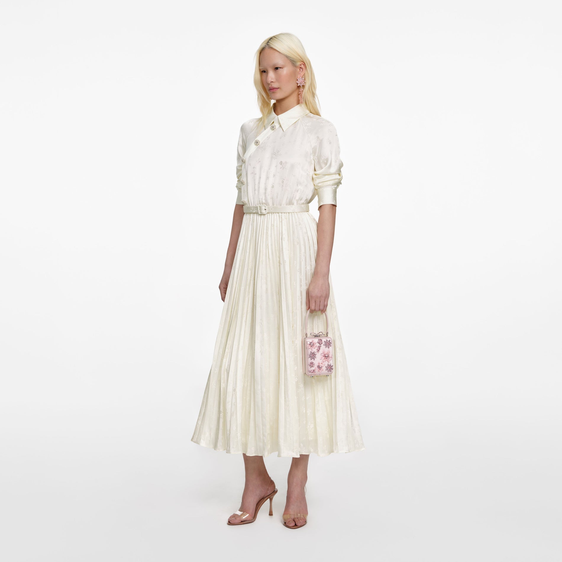 Side view of a woman wearing the Cream Satin Jacquard Midi Dress