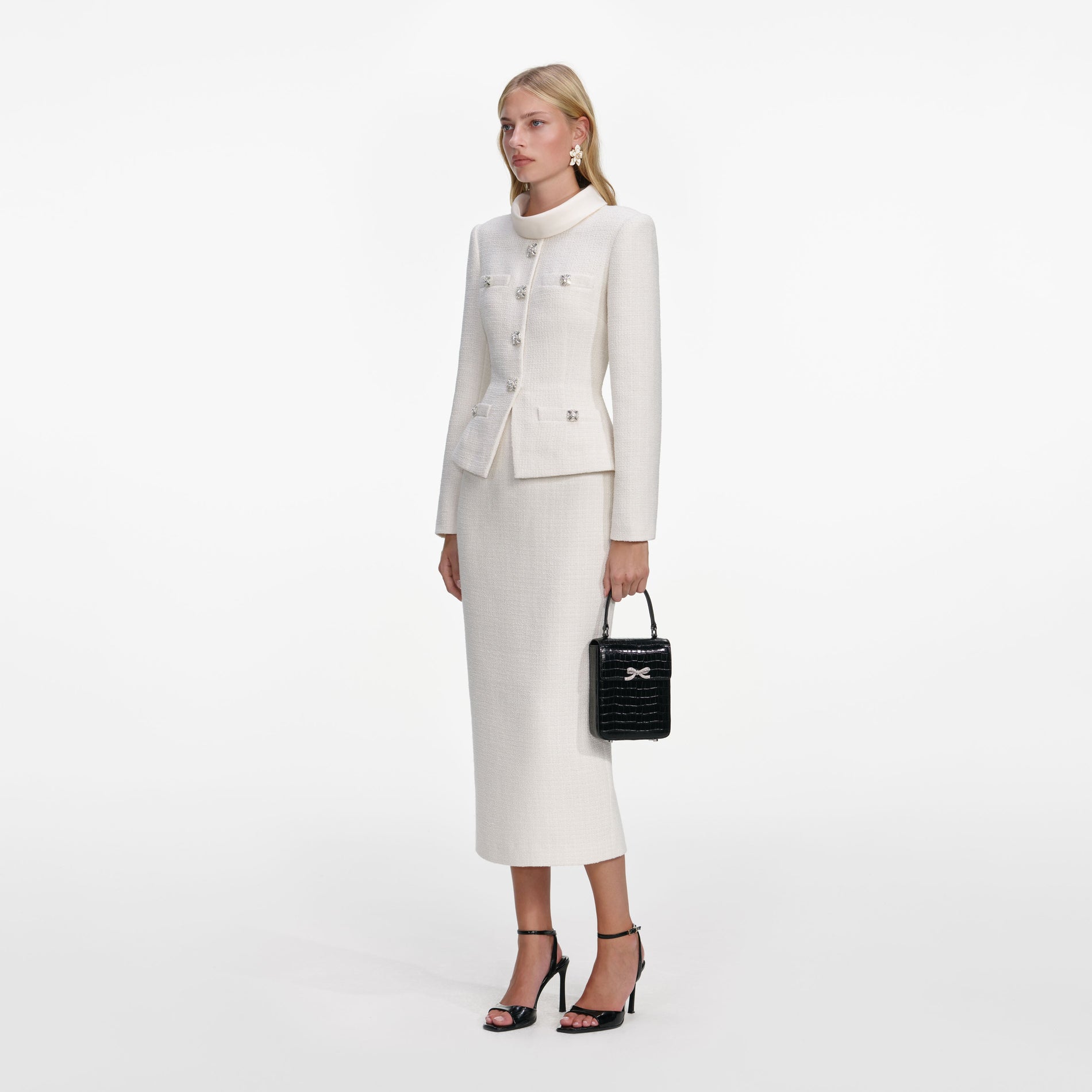 Side view of a woman wearing the Cream Boucle Tailored Midi Dress