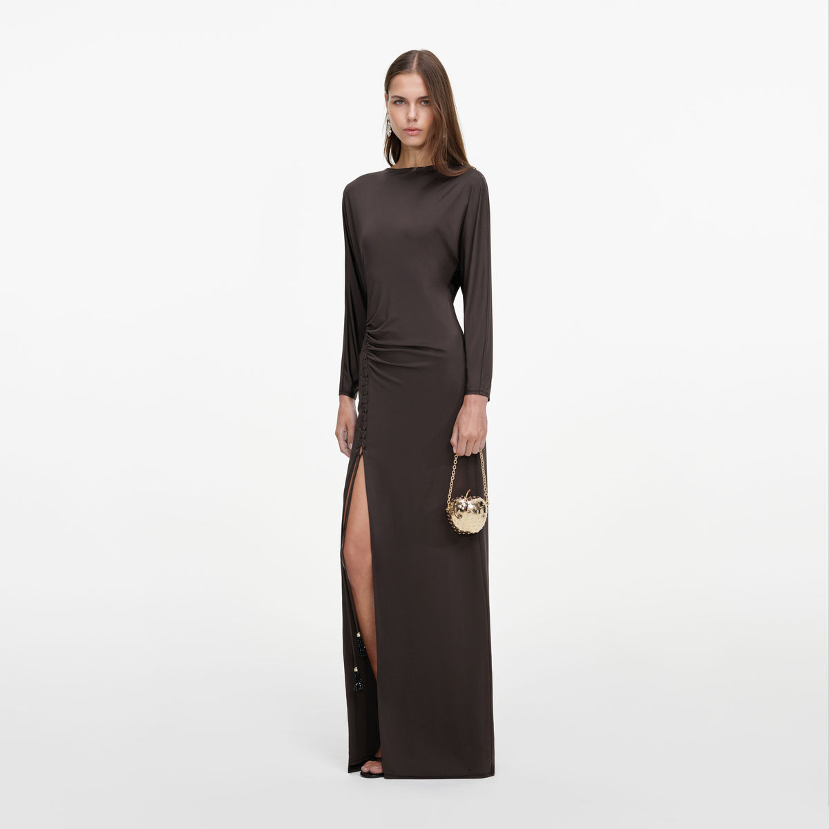 Side view of a woman wearing the Brown Jersey Open Back Maxi Dress