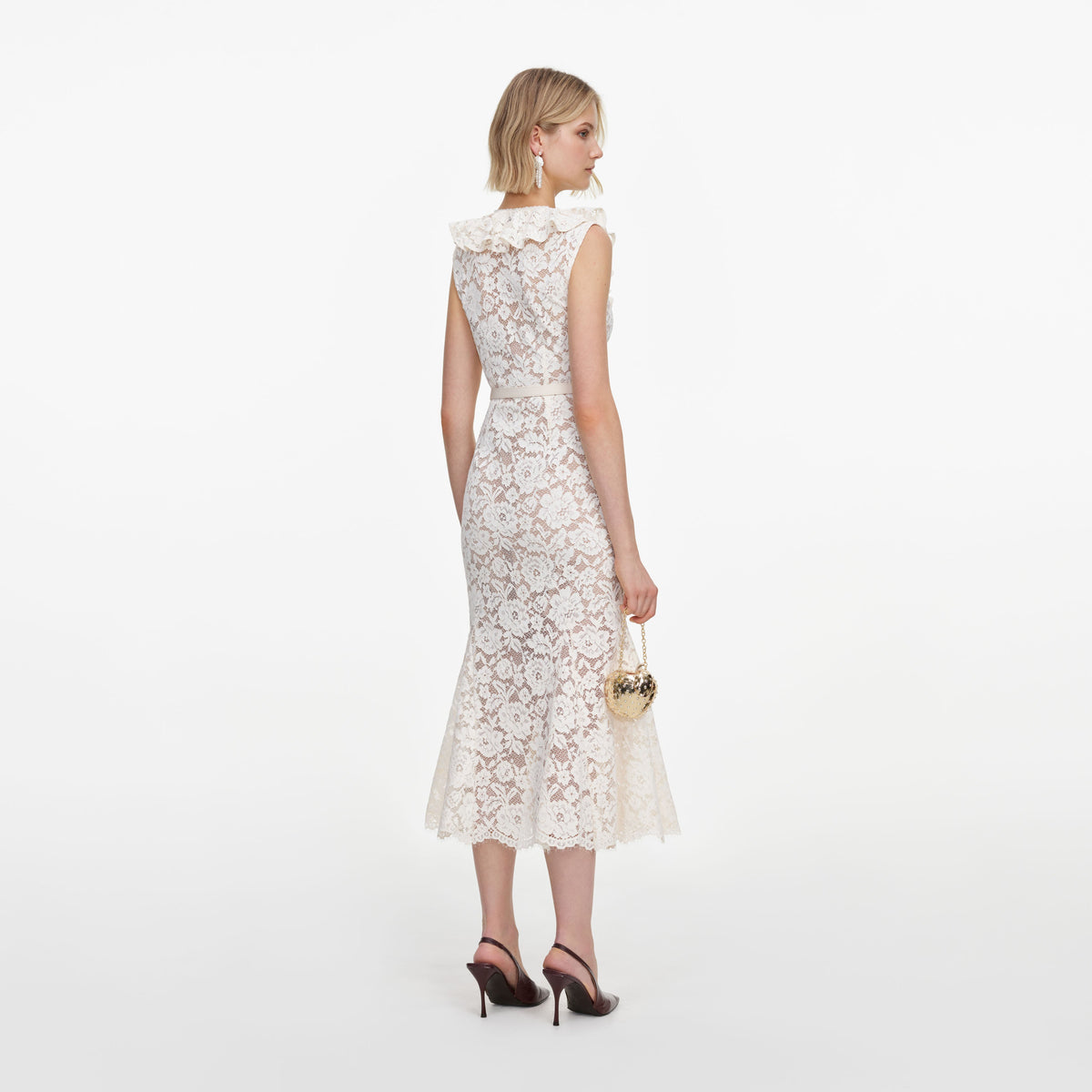 Back view of a woman wearing the Cream Lace Flower Midi Dress