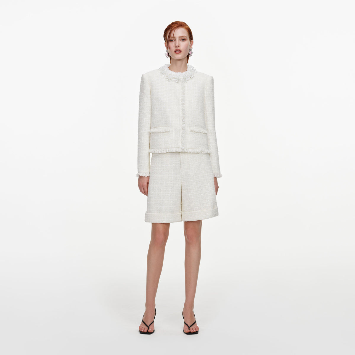 Front view of a woman wearing the Cream Sequin Boucle Pearl Trim Jacket
