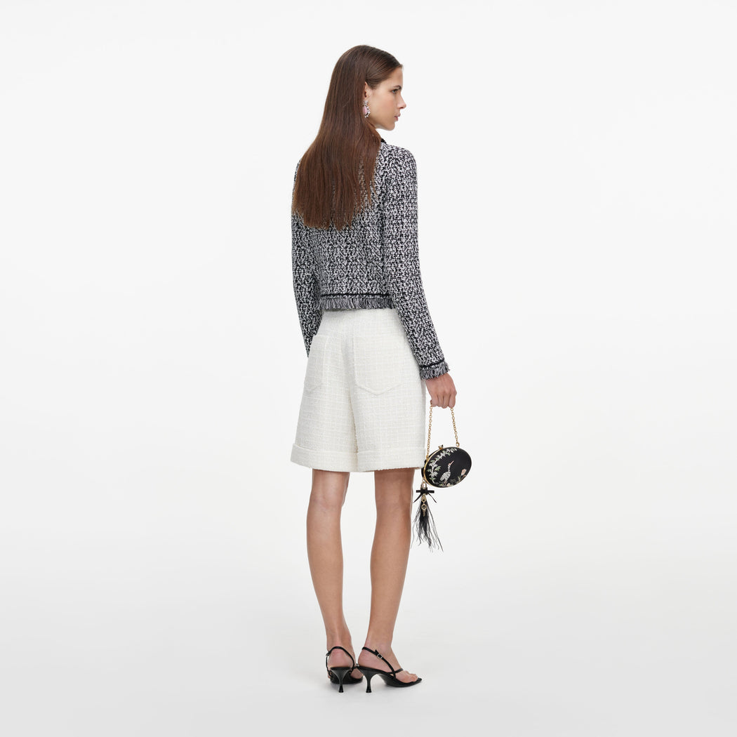 Back view of a woman wearing the Cream Sequin Boucle Tailored Shorts