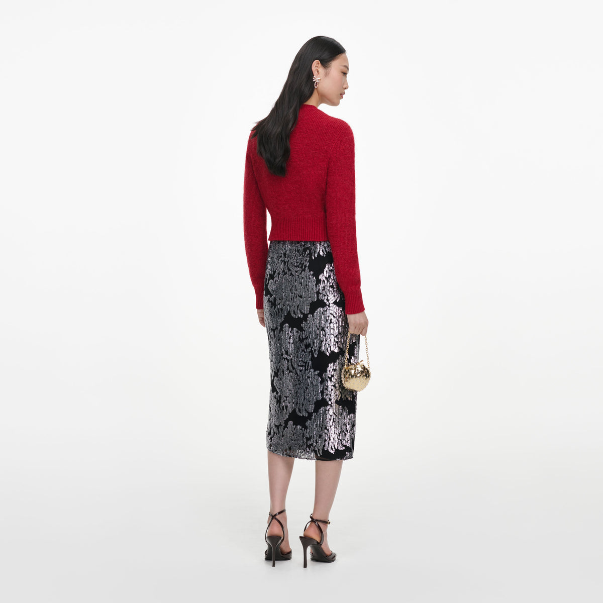 Back view of a woman wearing the Red Soft Knit Cardigan