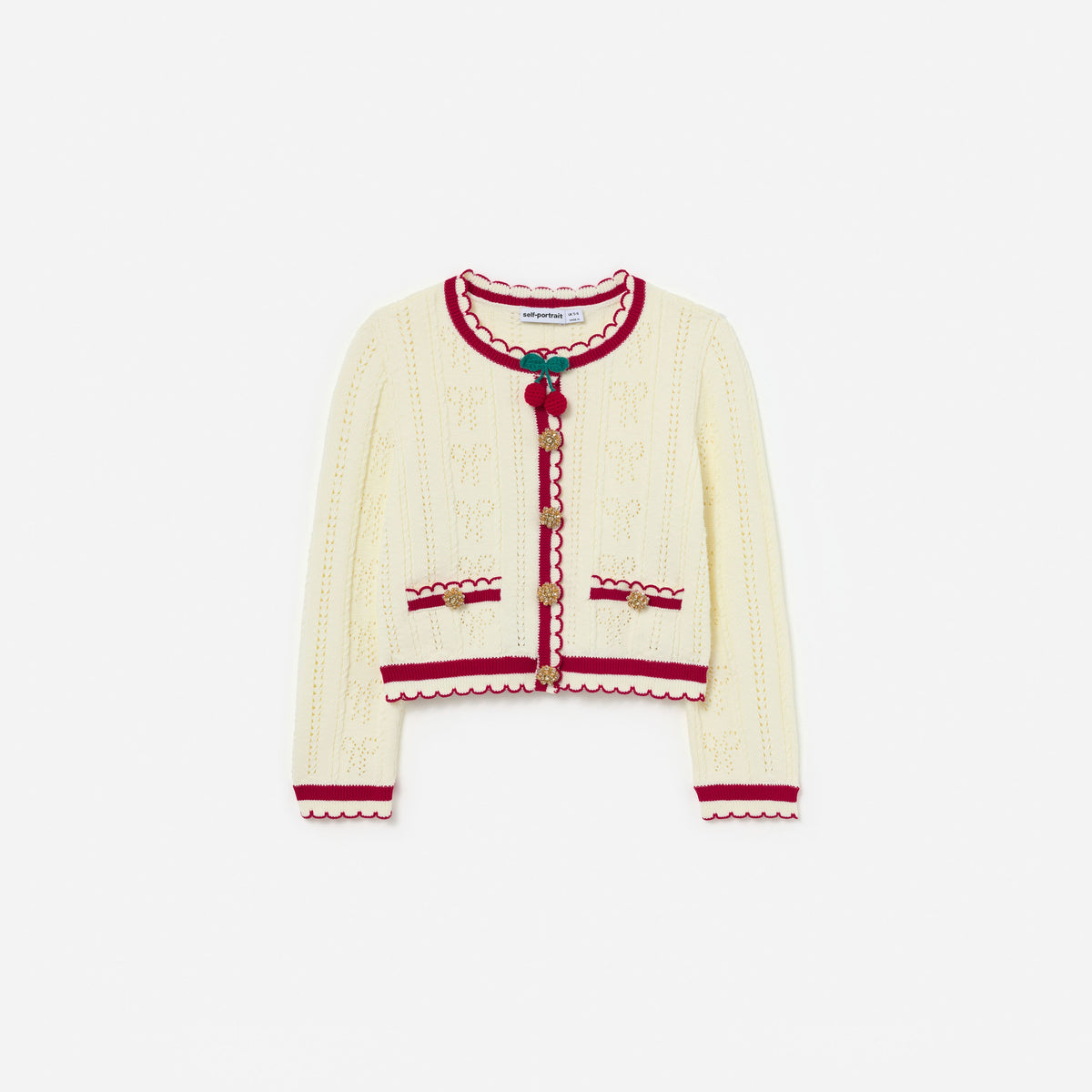 Front view of a girl wearing the Cream Pointelle Knit Stripe Cherry Cardigan