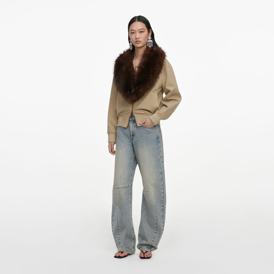 Side view of a woman wearing the Bleached Wash Jeans