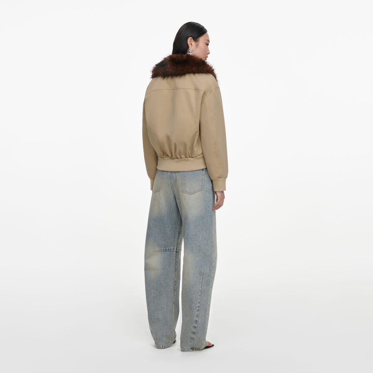 Back view of a woman wearing the Bleached Wash Jeans