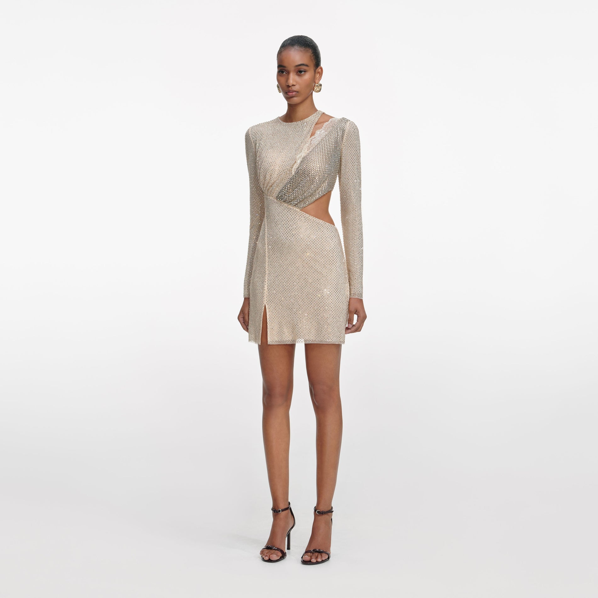 Side view of a woman wearing the Champagne Rhinestone Lace Trim Mini Dress