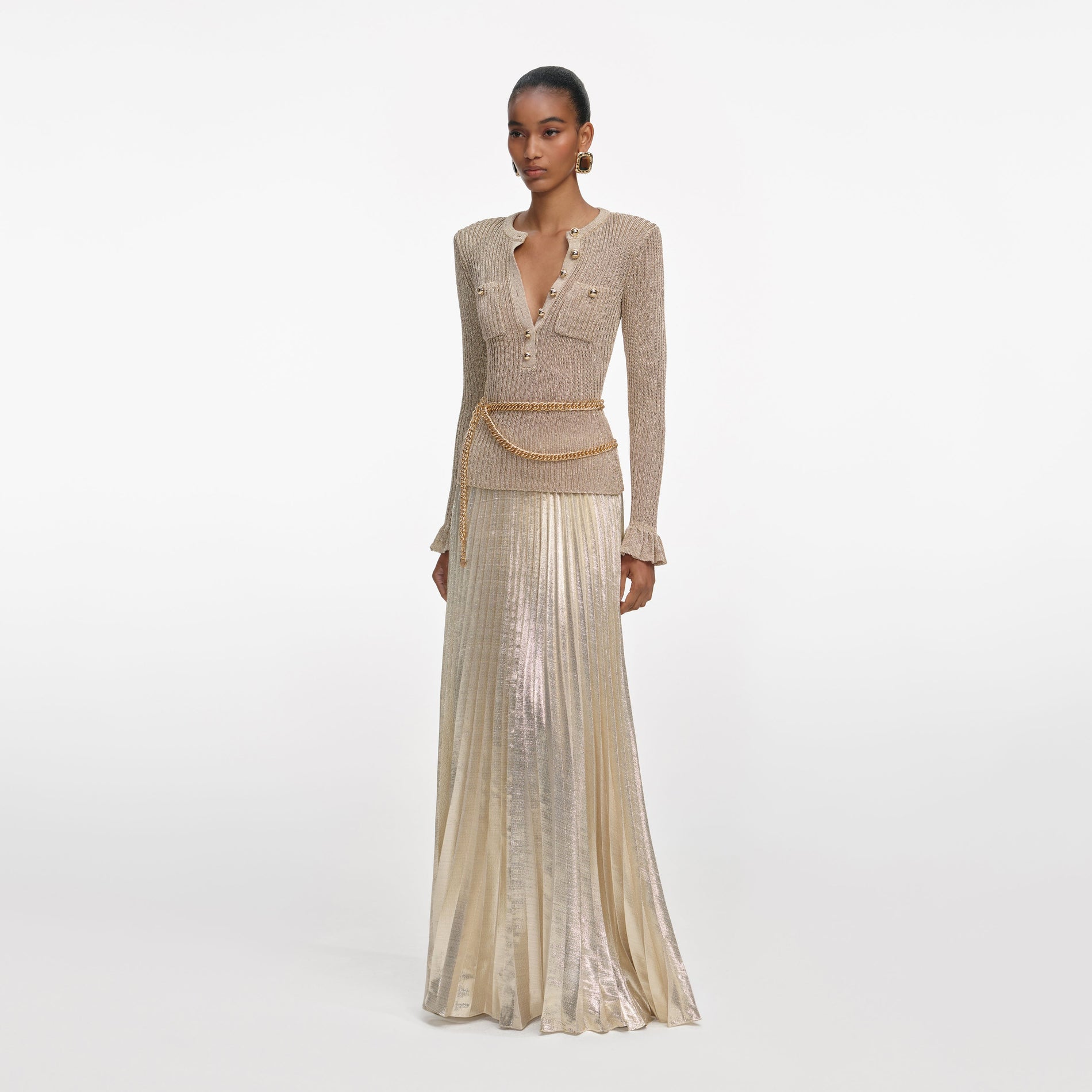 Side view of a woman wearing the Gold Lurex Ribbed Knit Maxi Dress