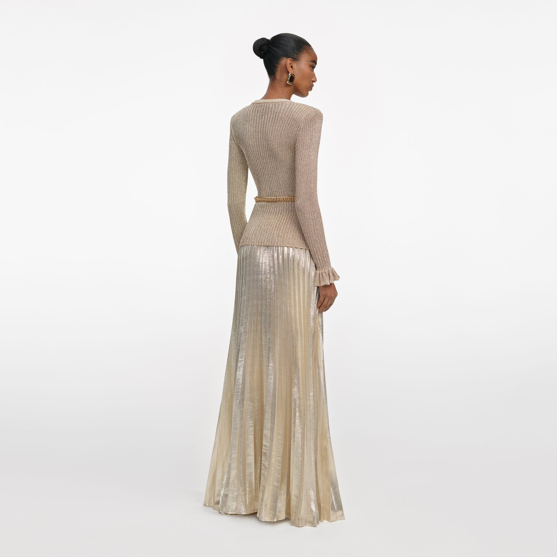 Back view of a woman wearing the Gold Lurex Ribbed Knit Maxi Dress