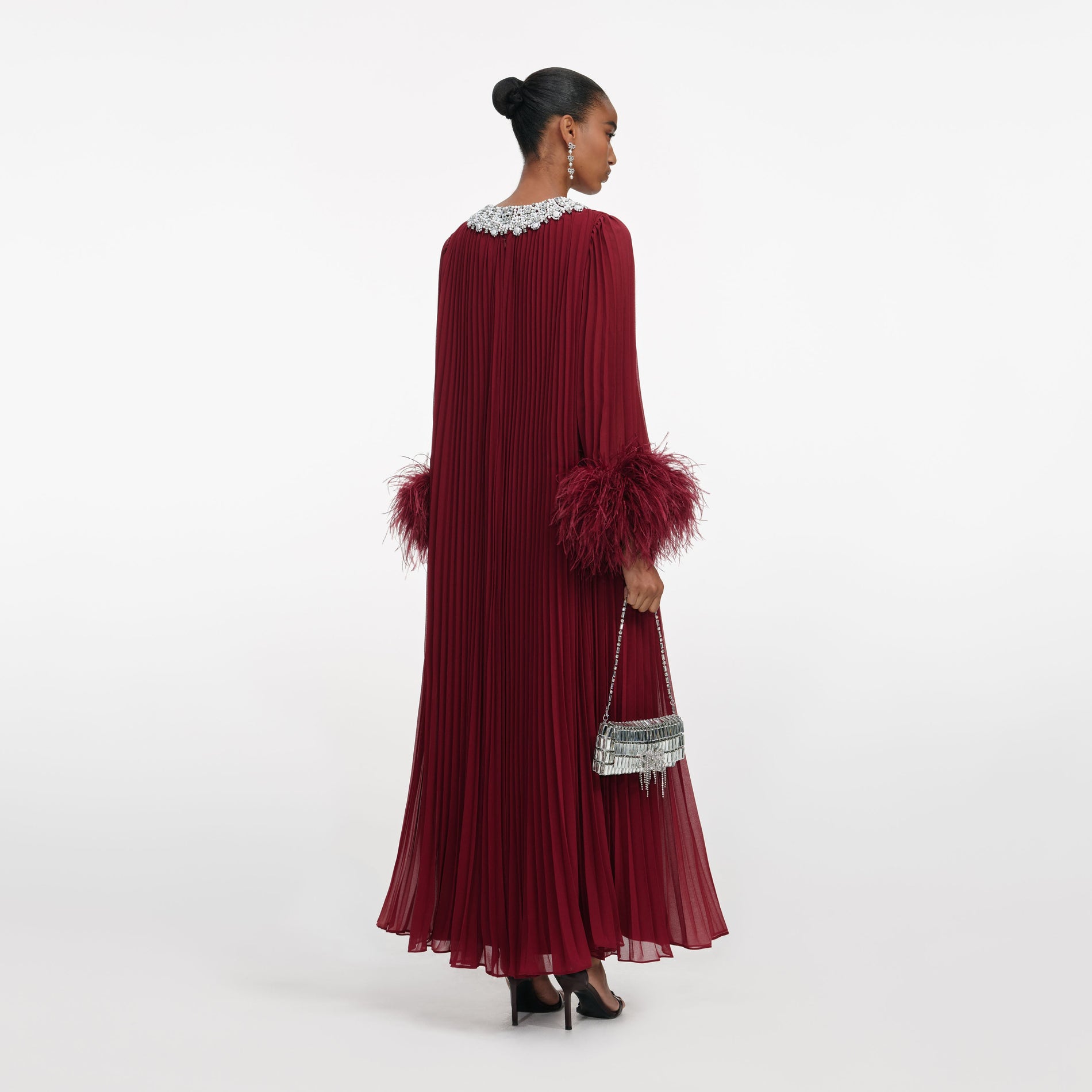 Back view of a woman wearing the Burgundy Chiffon Feather Midi Dress