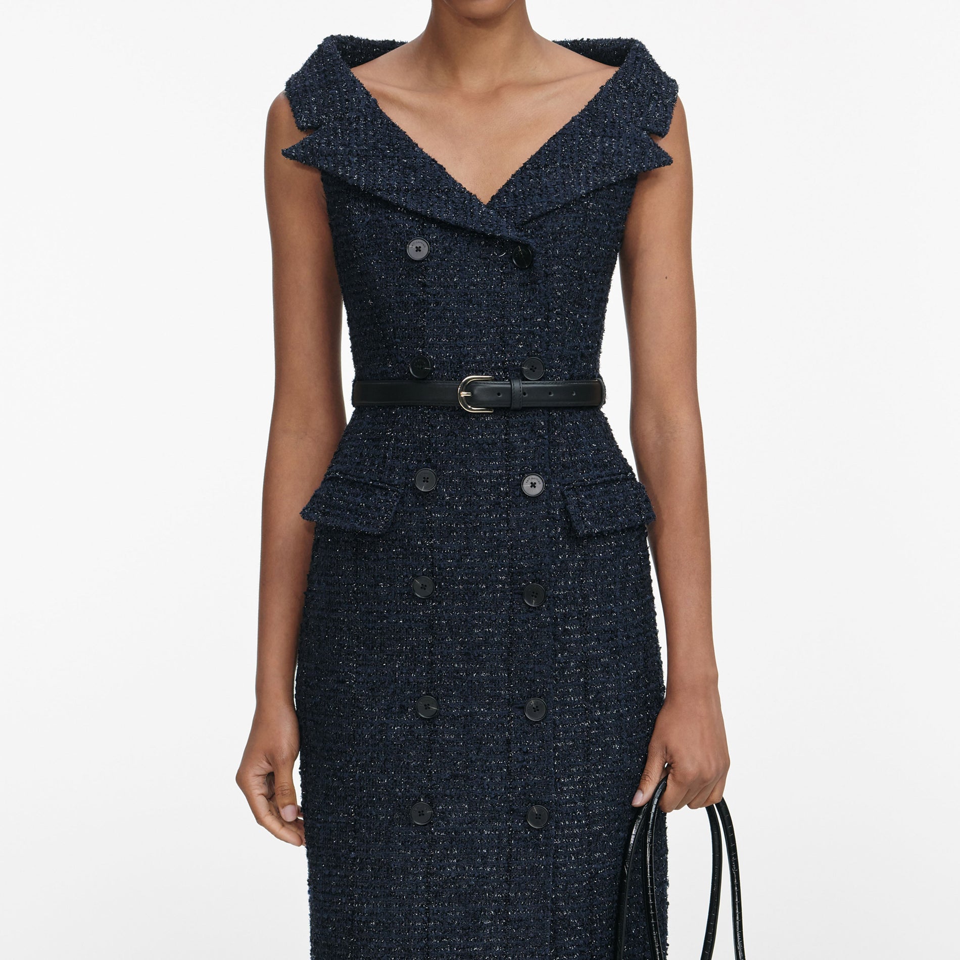 A close up of a woman wearing the Navy Boucle Midi Dress