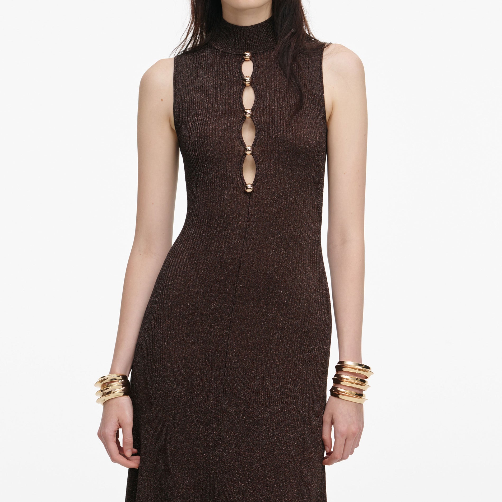 A close up of a woman wearing the Brown Lurex Knit Maxi Dress