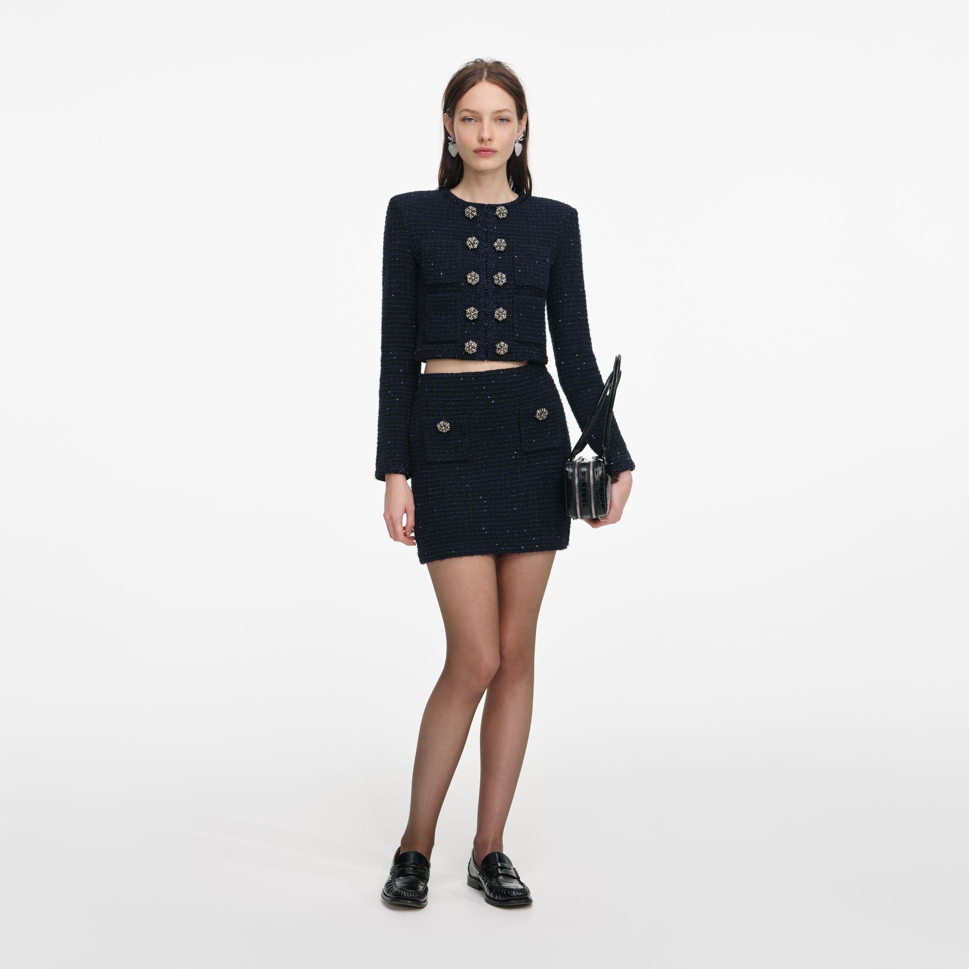 Front view of a woman wearing the Navy Textured Knit Mini Skirt