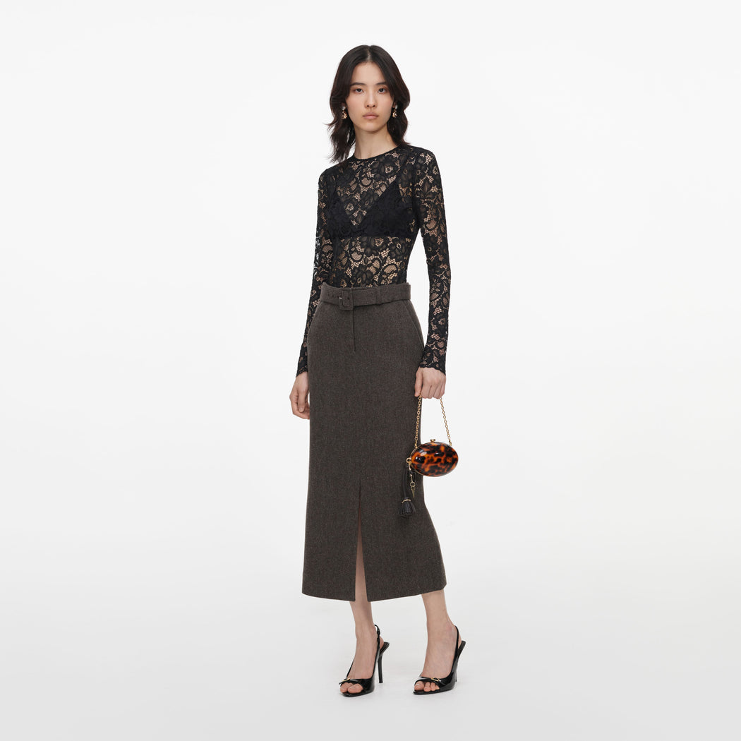 Side view of a woman wearing the Brown Wool Midi Skirt