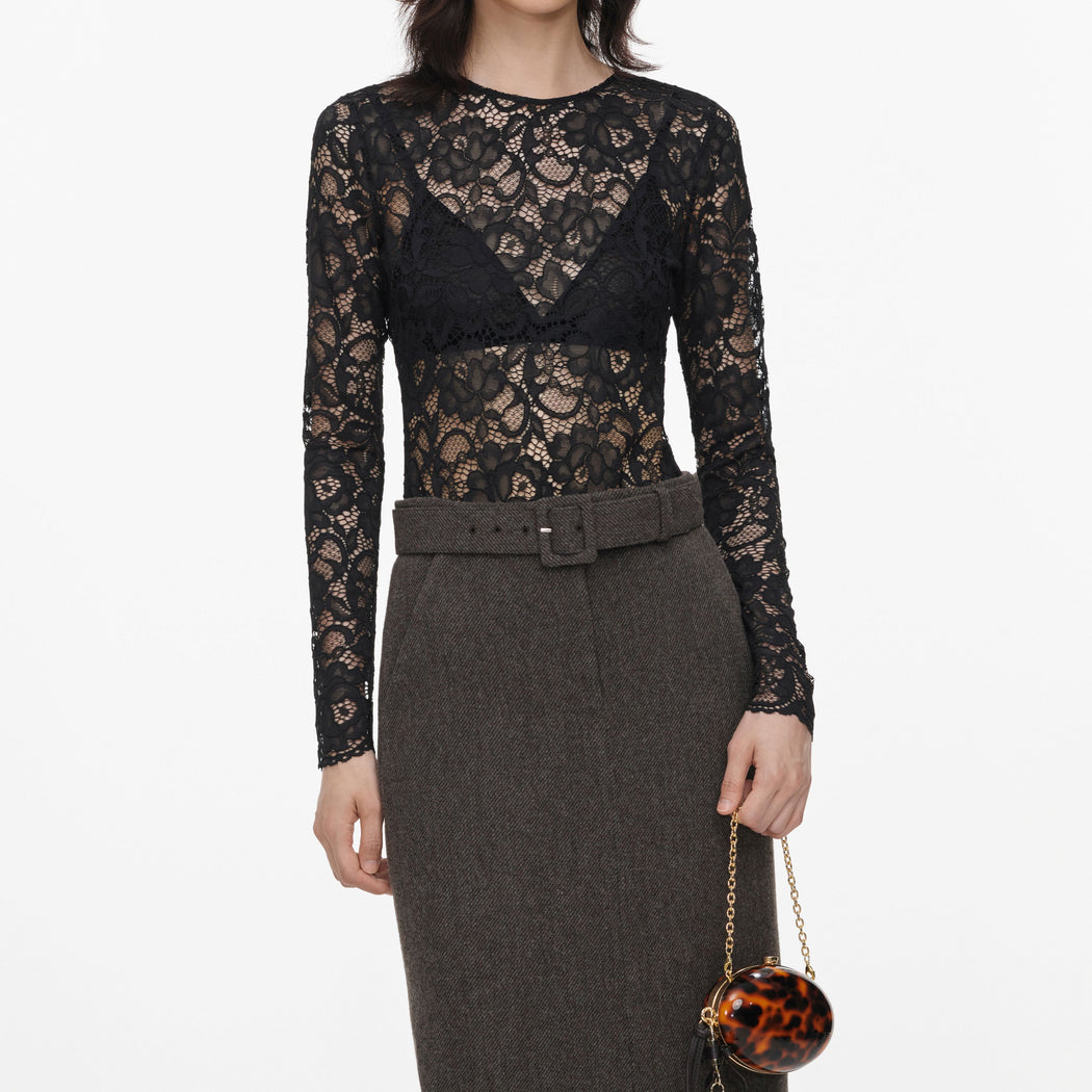 A close up of a woman wearing the Brown Wool Midi Skirt