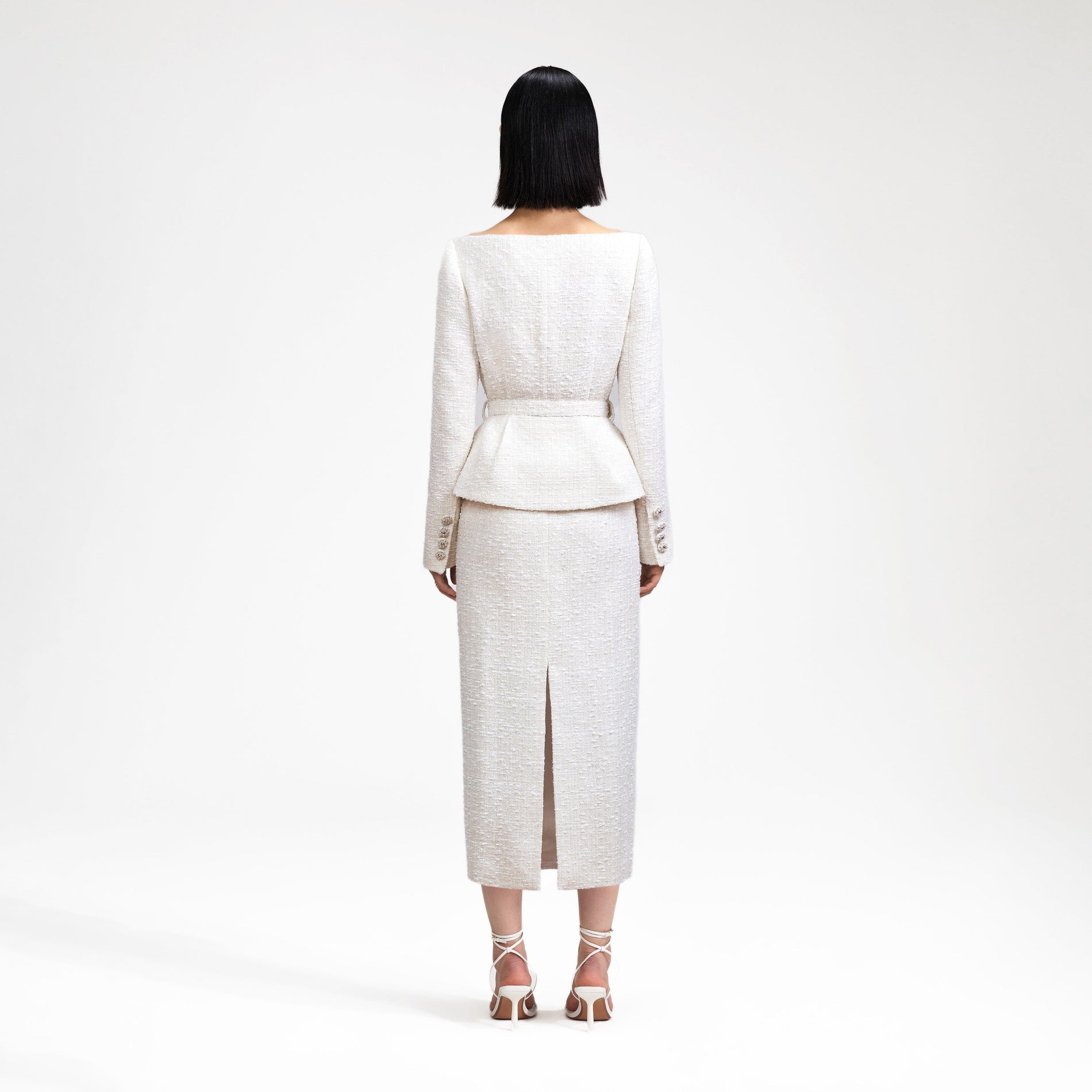 Back view of a woman wearing the Cream Off Shoulder Boucle Midi Dress